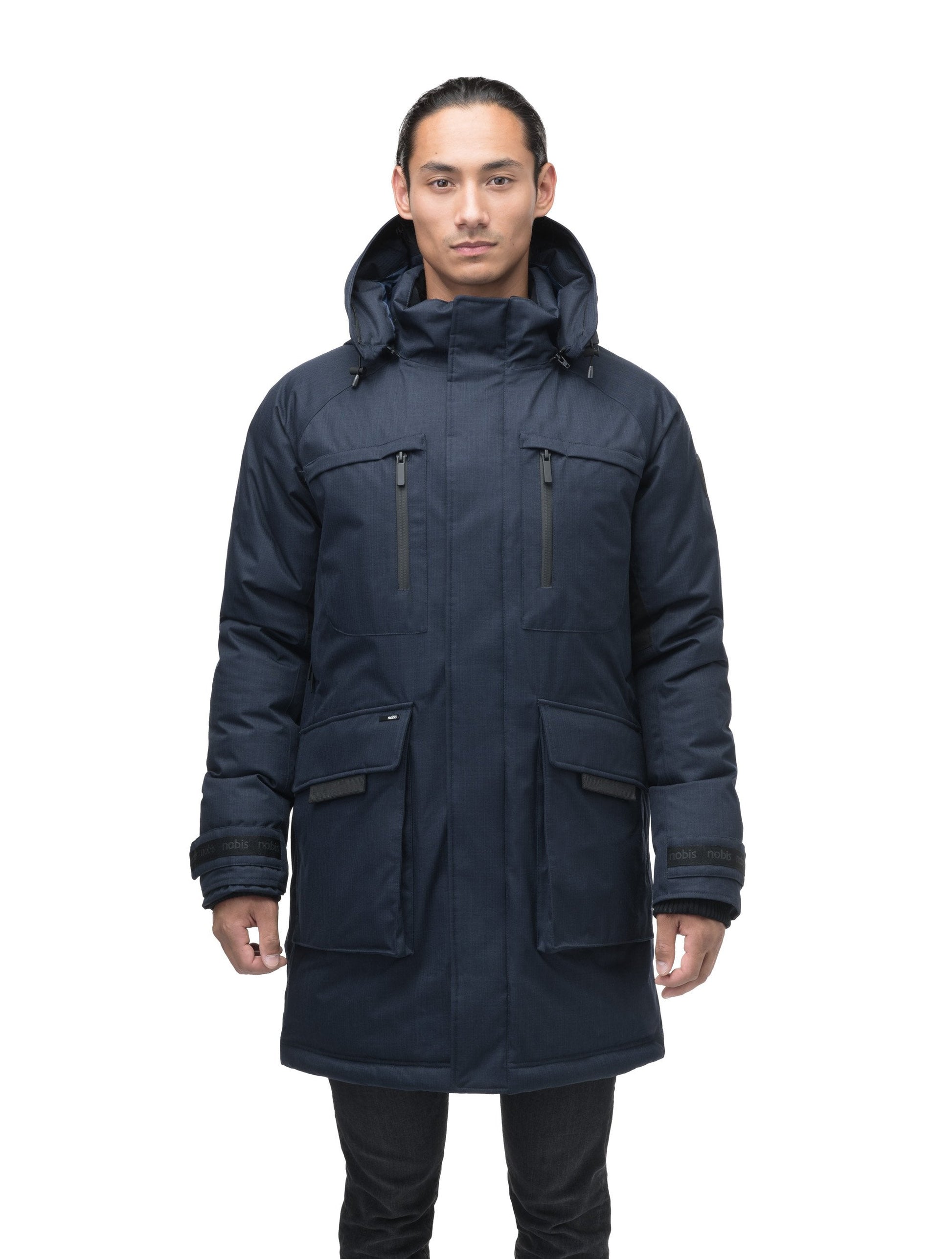 Men's thigh length down-filled parka with removable hood and removable coyote fur trim in Navy