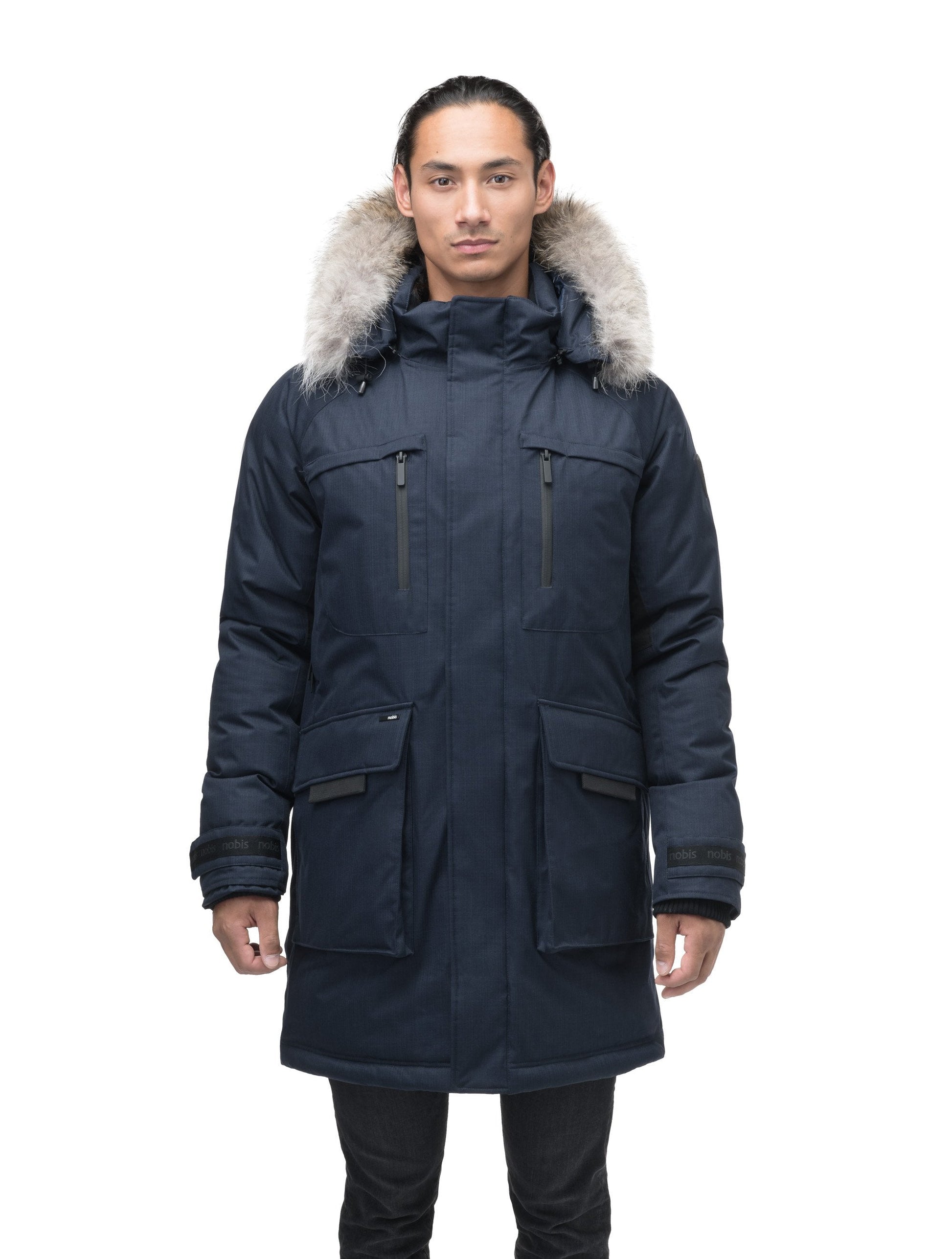 Men's thigh length down-filled parka with removable hood and removable coyote fur trim in Navy