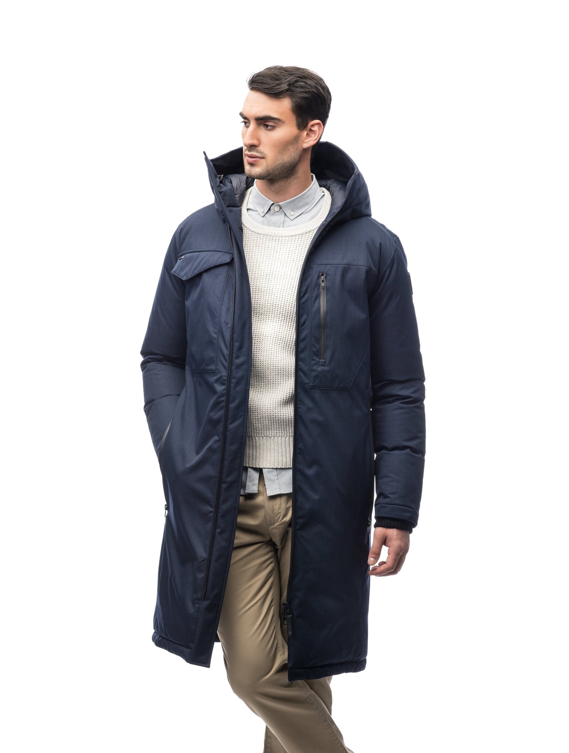 Long men's calf length parka with down fill and exposed zipper that features spacious pockets and zippered vents in Navy