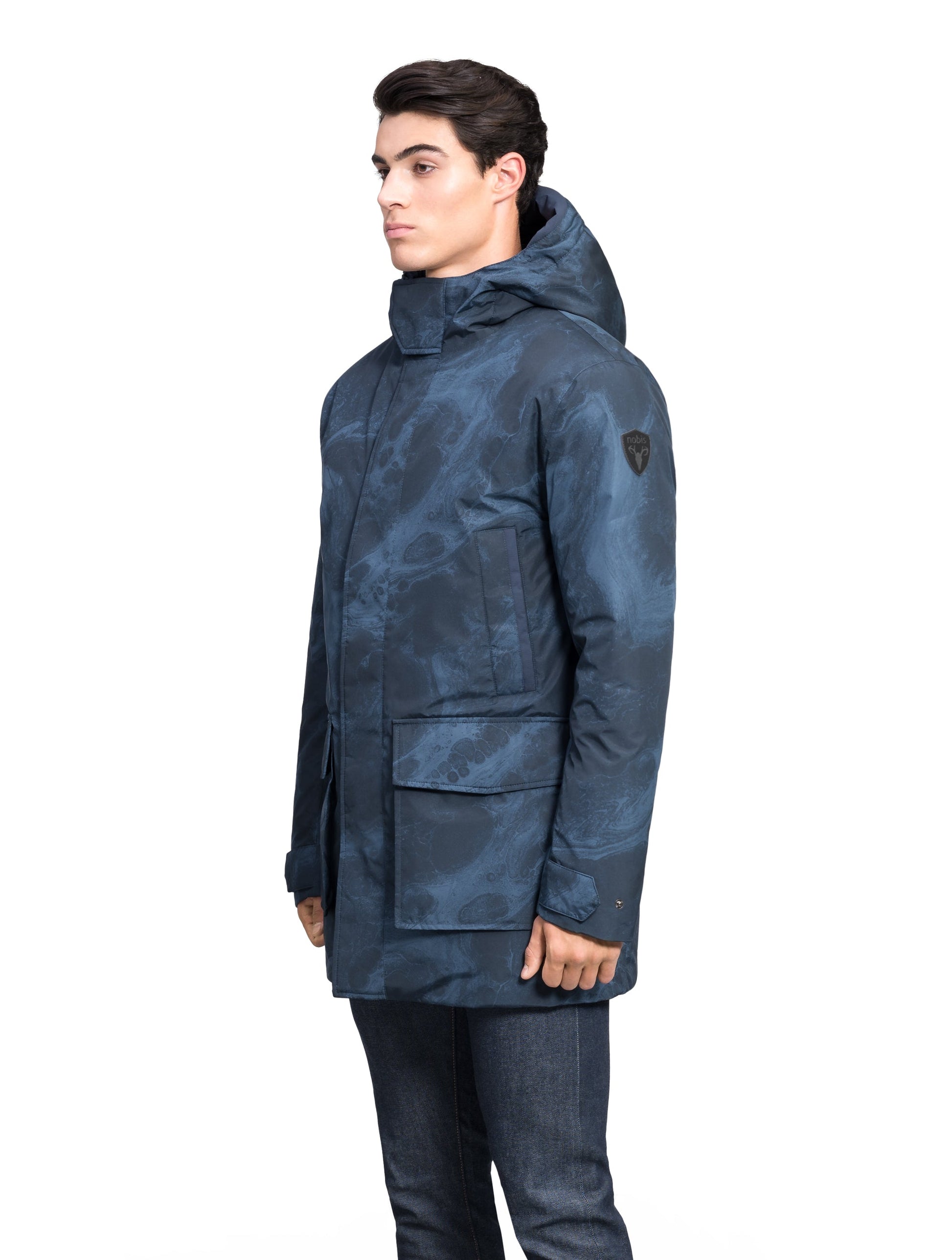 Kason Men's Light Down Parka in thigh length, premium 3-ply micro denier and stretch ripstop fabrication, Premium Canadian origin White Duck Down insulation, non-removable down-filled hood, two-way centre-front zipper, magnetic closure wind flap, fleece-lined pockets at chest and waist, flap pockets at waist, pit zipper vents, in Navy