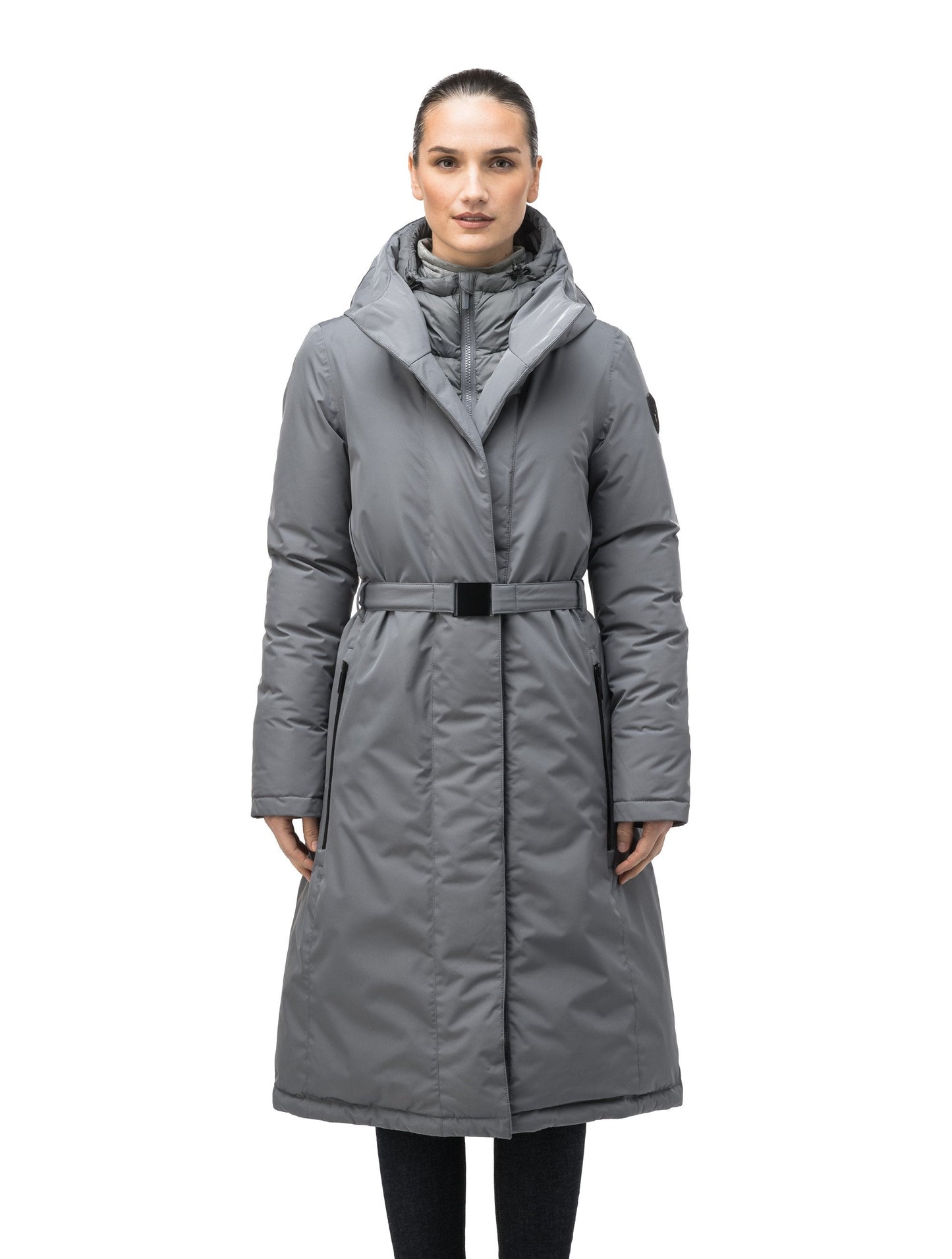 Long calf length hooded women's winter parka with an inner hip length closure, exterior hem length zipper and magentic placket in Concrete