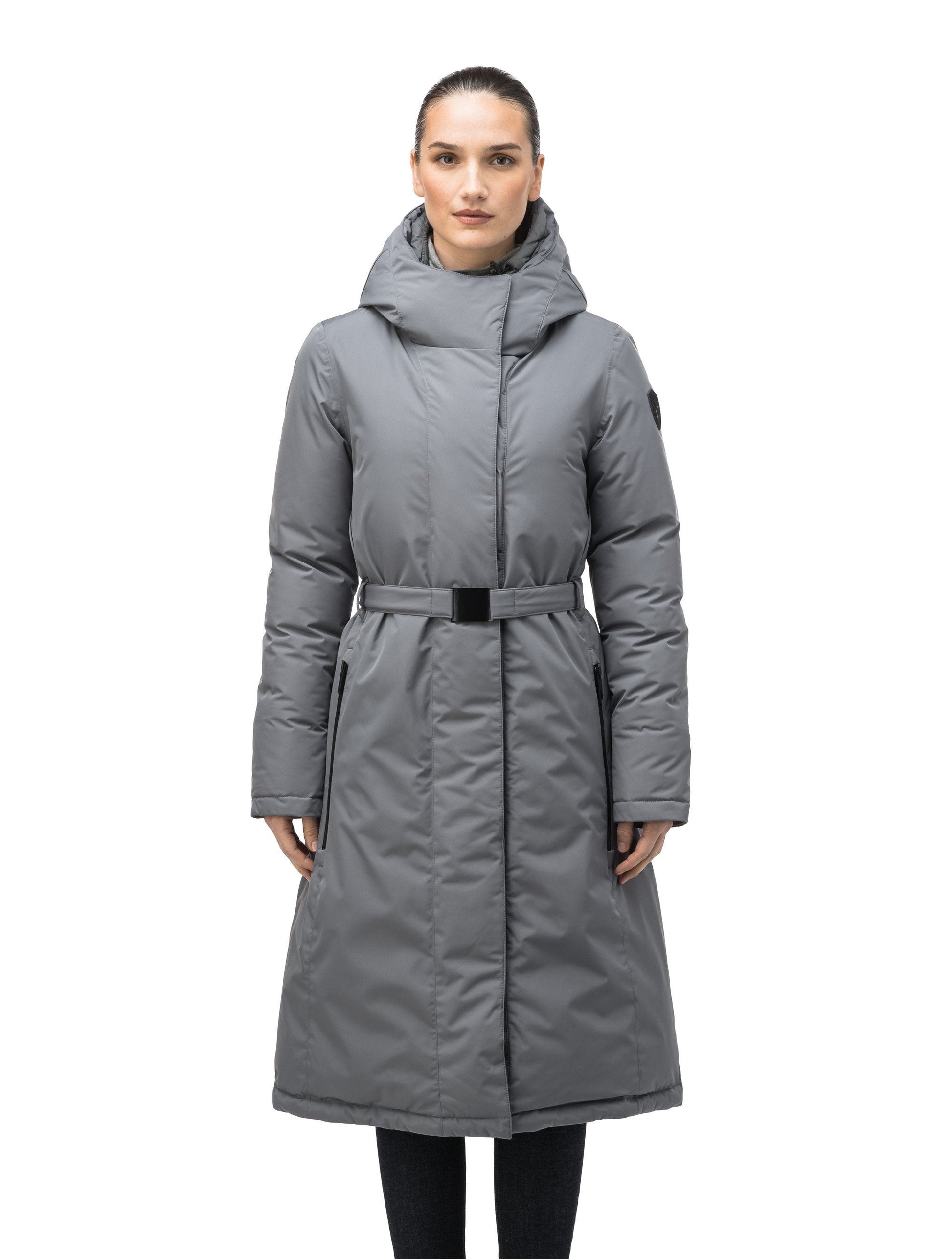 Long calf length hooded women's winter parka with an inner hip length closure, exterior hem length zipper and magentic placket in Concrete