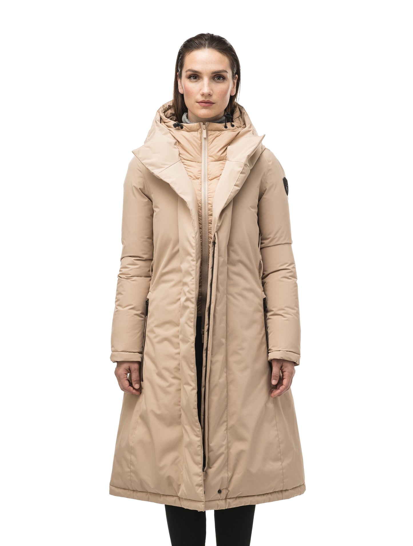 Long calf length hooded women's winter parka with an inner hip length closure, exterior hem length zipper and magentic placket in Fawn