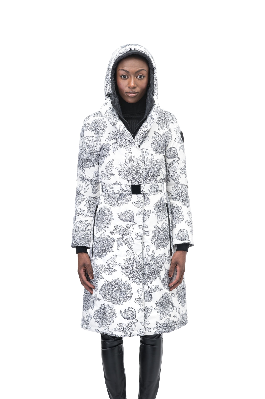 Long calf length hooded women's winter parka with an inner hip length closure, exterior hem length zipper and magnetic placket in White Floral