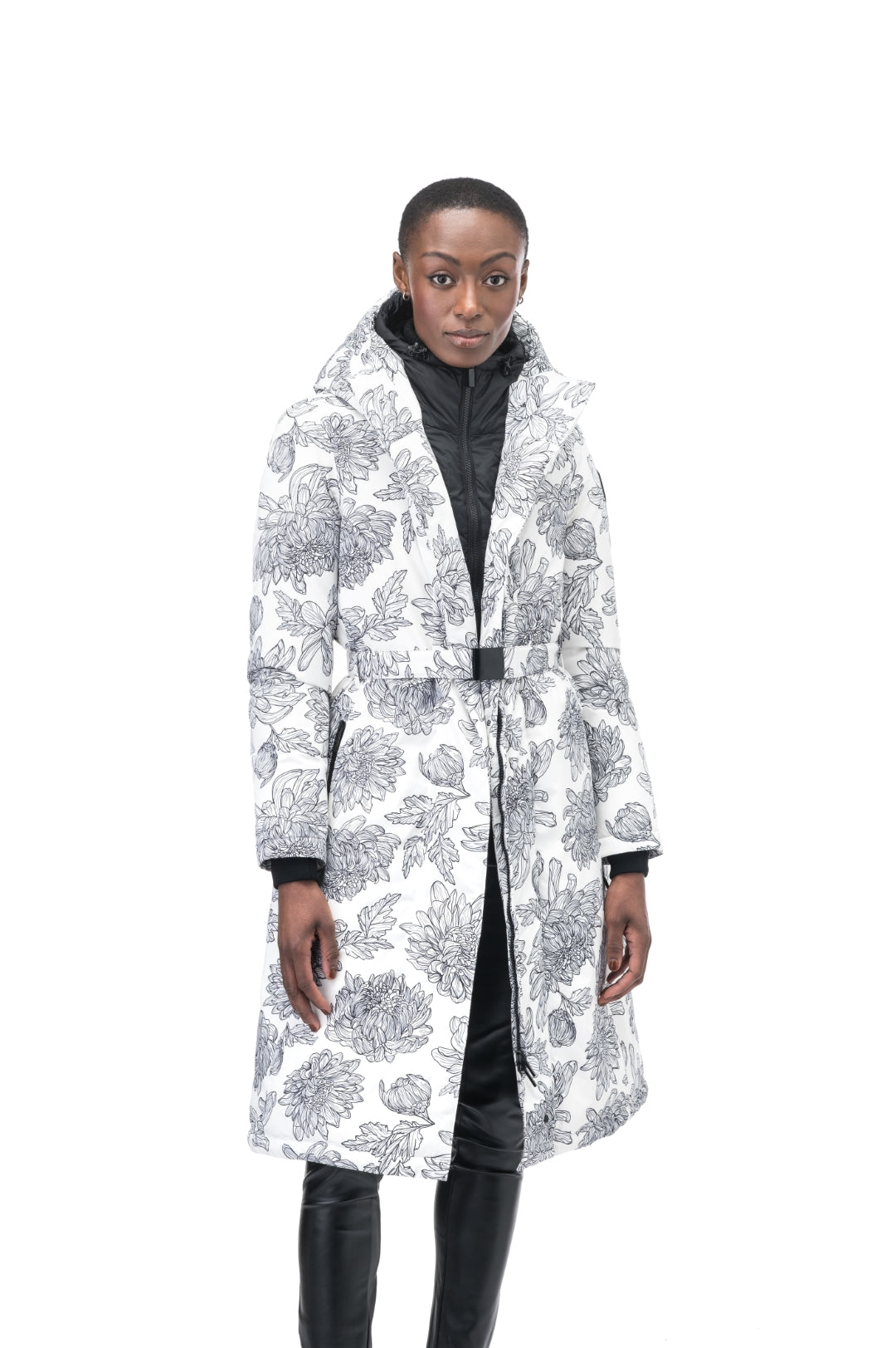 Long calf length hooded women's winter parka with an inner hip length closure, exterior hem length zipper and magnetic placket in White Floral