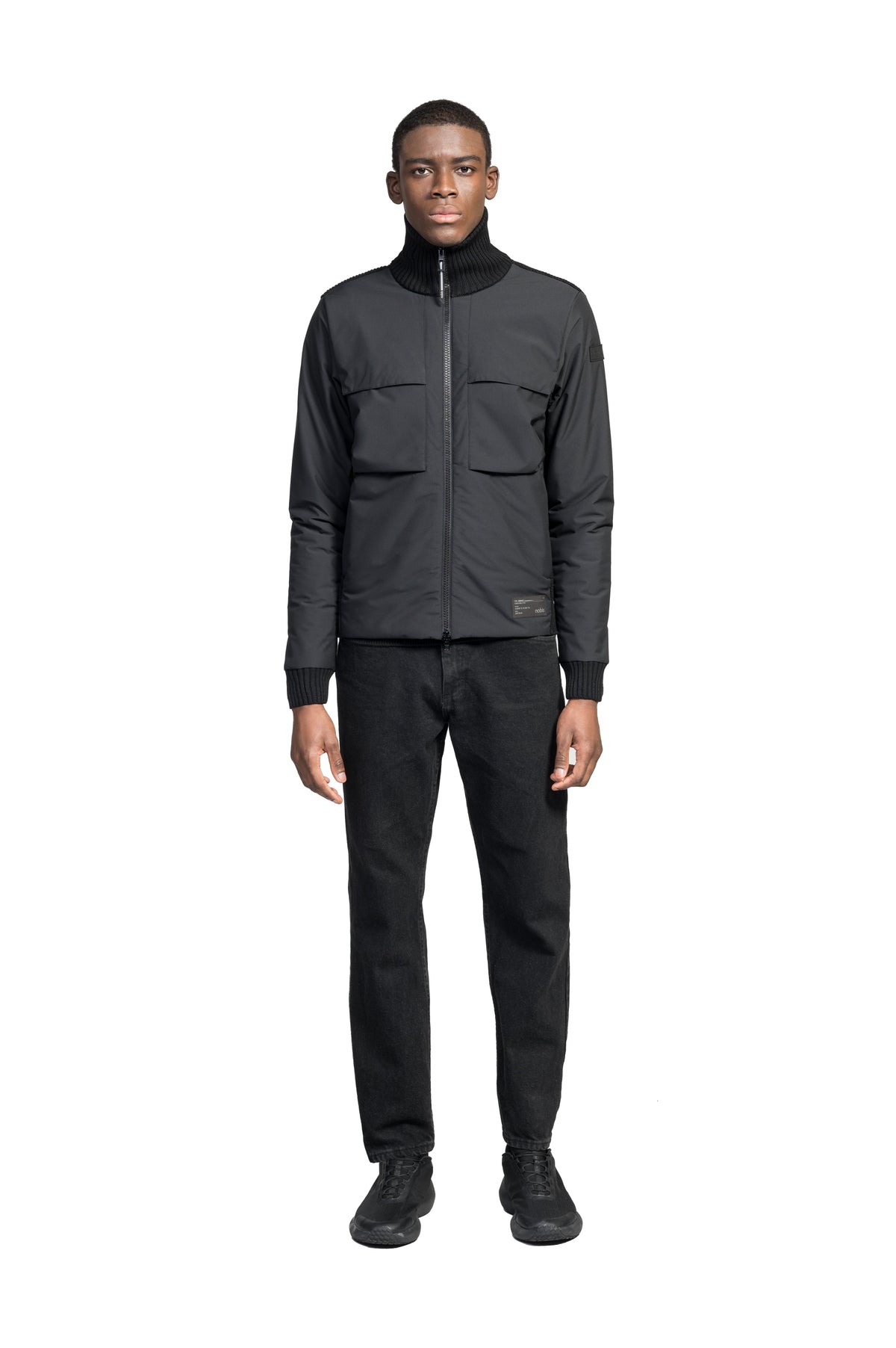 Layton Men's Tactical Hybrid Sweater in hip length, Primaloft Gold Insulation Active+, Merion wool knit collar, sleeves, back, and cuffs, two-way front zipper, and pockets at chest and waist, in Black