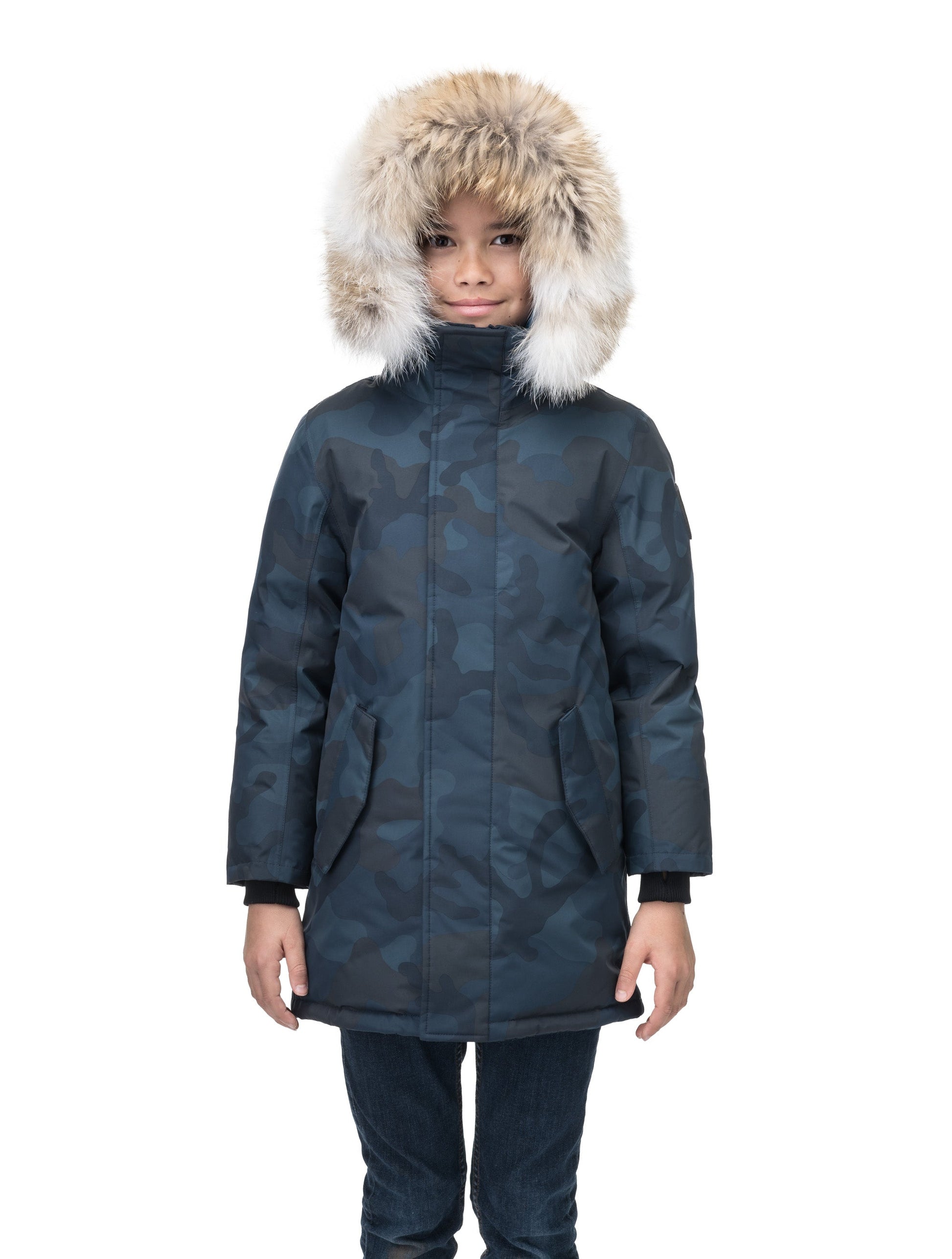 Kids' thigh length down-filled parka with non-removable hood and removable coyote fur trim in Navy Camo