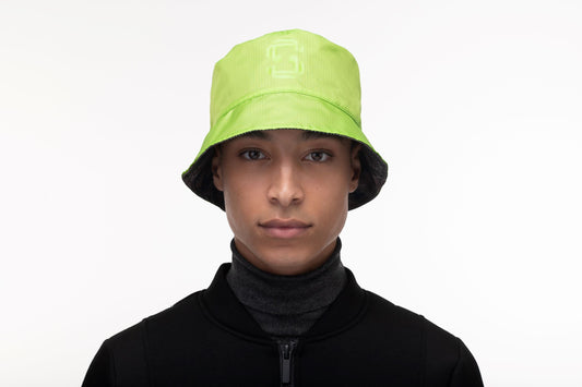 Unisex reversible bucket hat with one side in camouflage and "MAFUZZY" printed on the rim, and the reversed side with the "S" logo printed on the crown in tonal Greenery