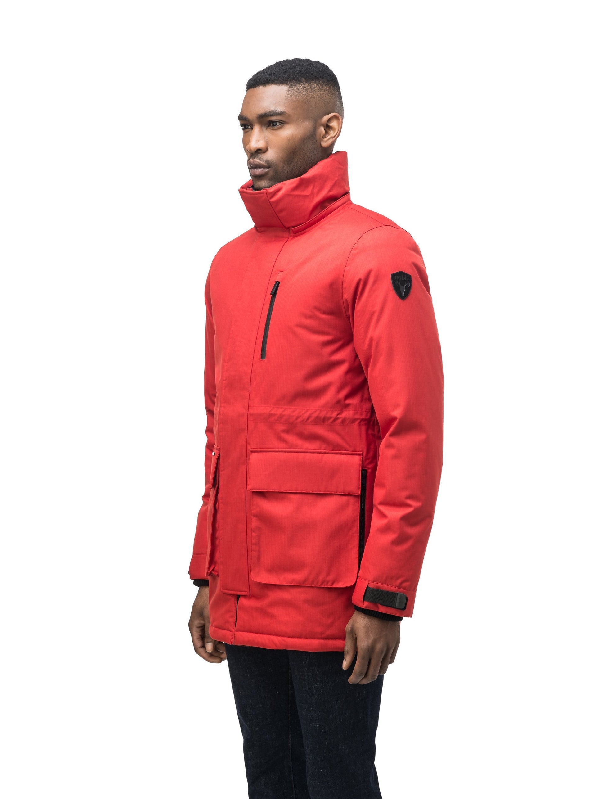 Mid weight men's down filled parka with two patch pockets at the hip and snap closure side vents in Vermillion