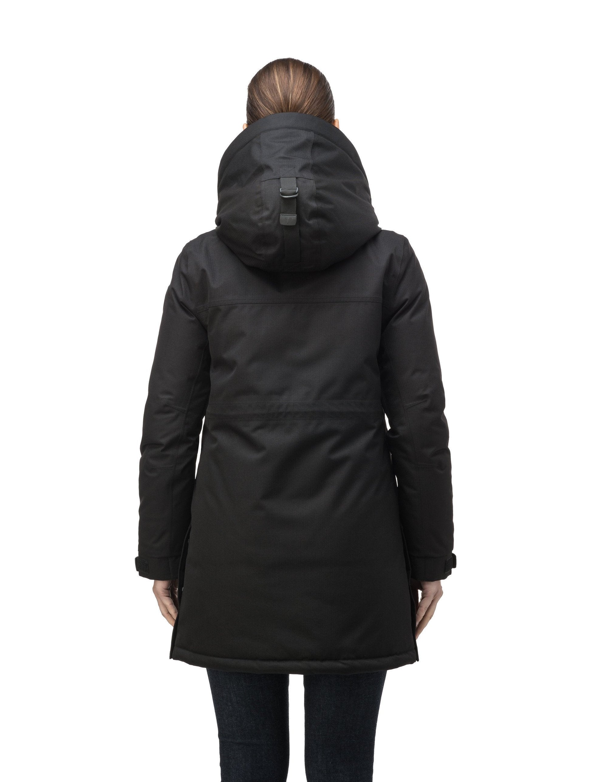 Thigh length women's down filled parka with side entry pockets and drawcord waist, removable hood and fur trim in Black