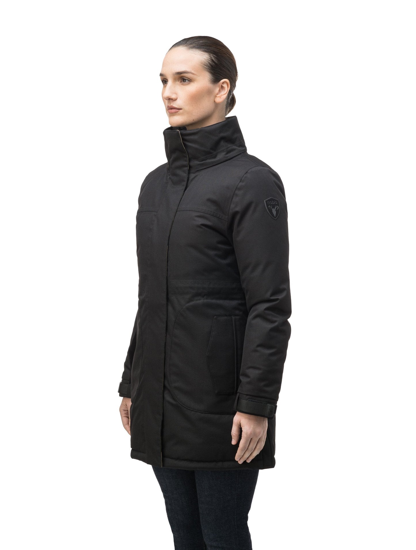 Thigh length women's down filled parka with side entry pockets and drawcord waist, removable hood and fur trim in Black