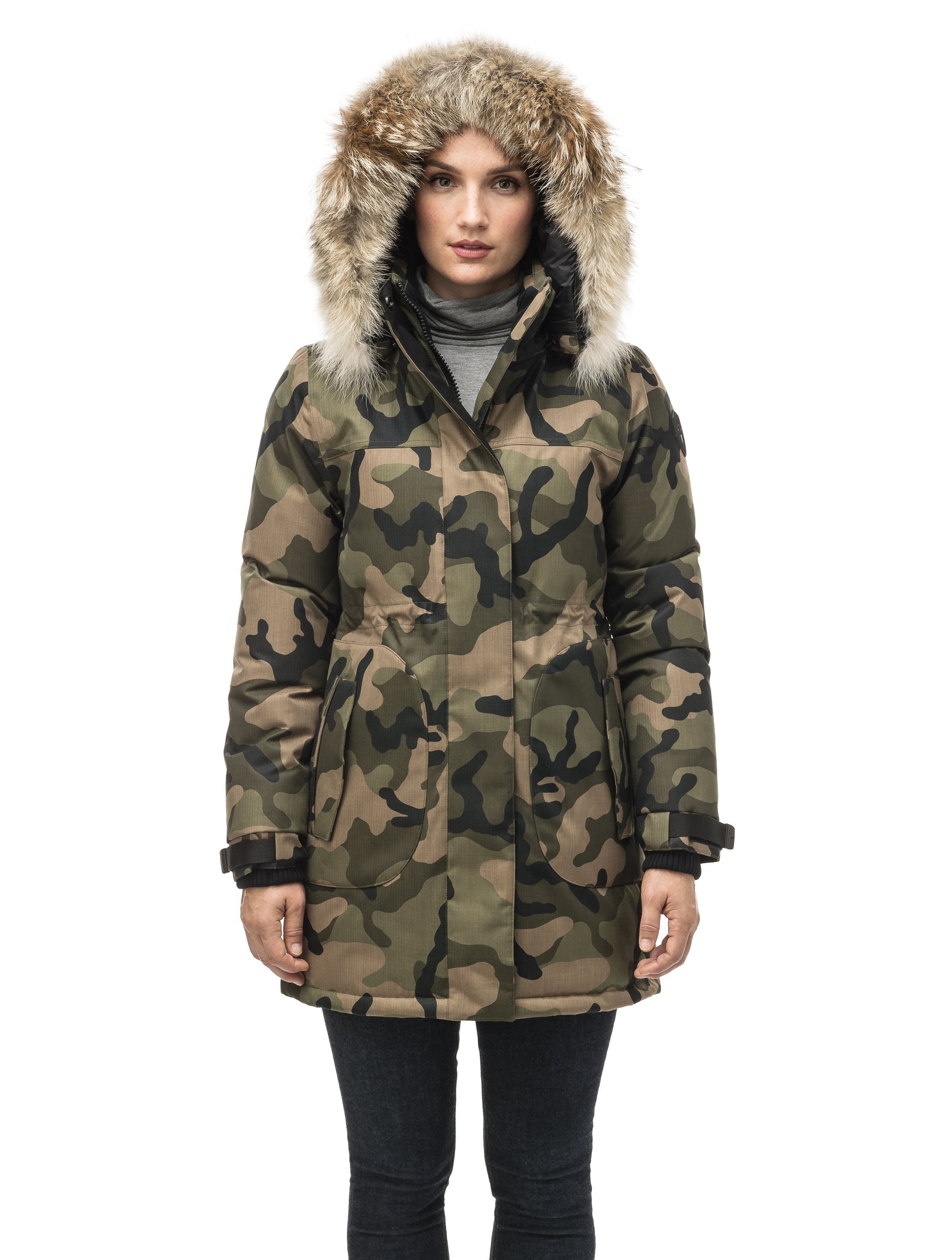 Thigh length women's down filled parka with side entry pockets and drawcord waist, removable hood and fur trim in Camo