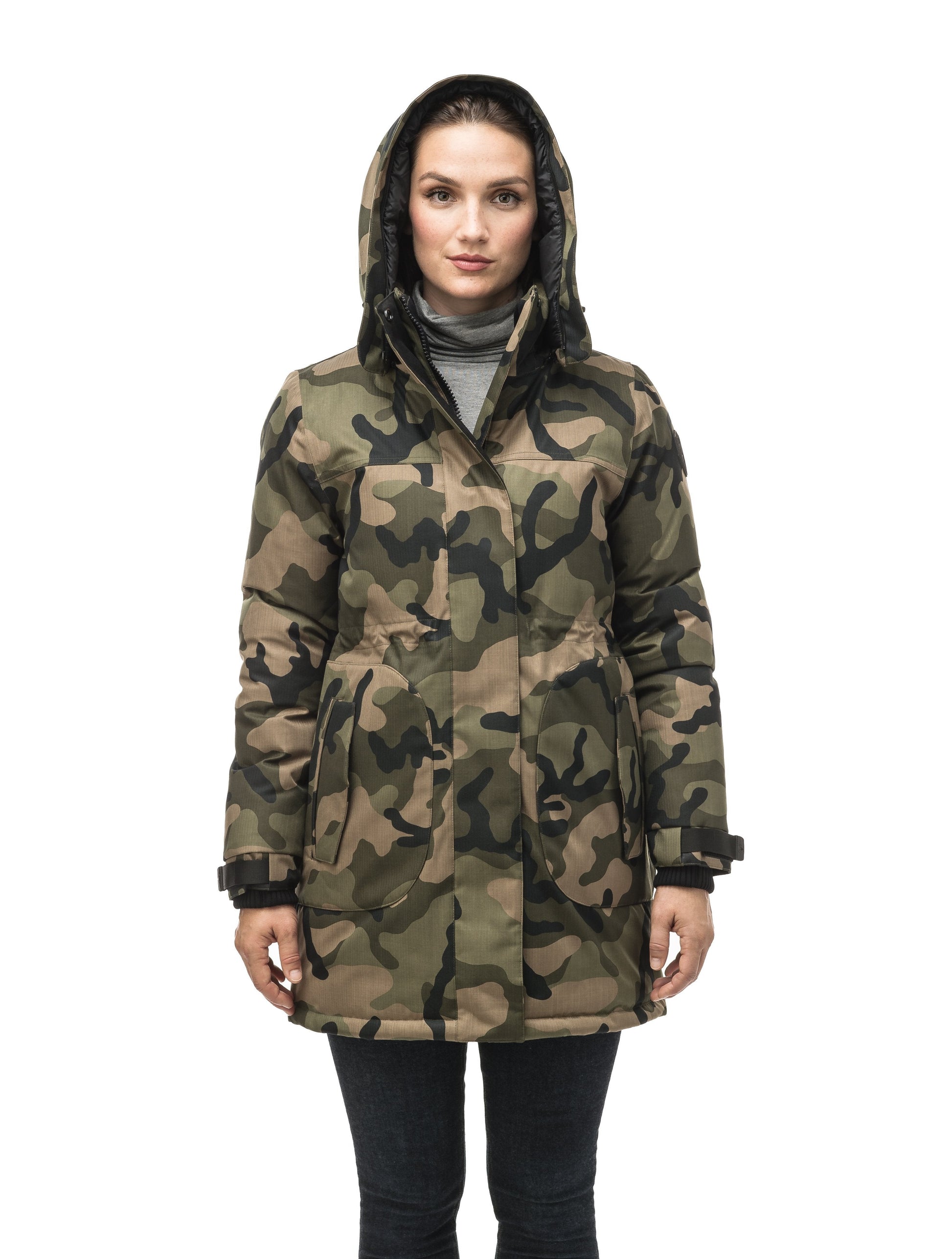 Thigh length women's down filled parka with side entry pockets and drawcord waist, removable hood and fur trim in Camo