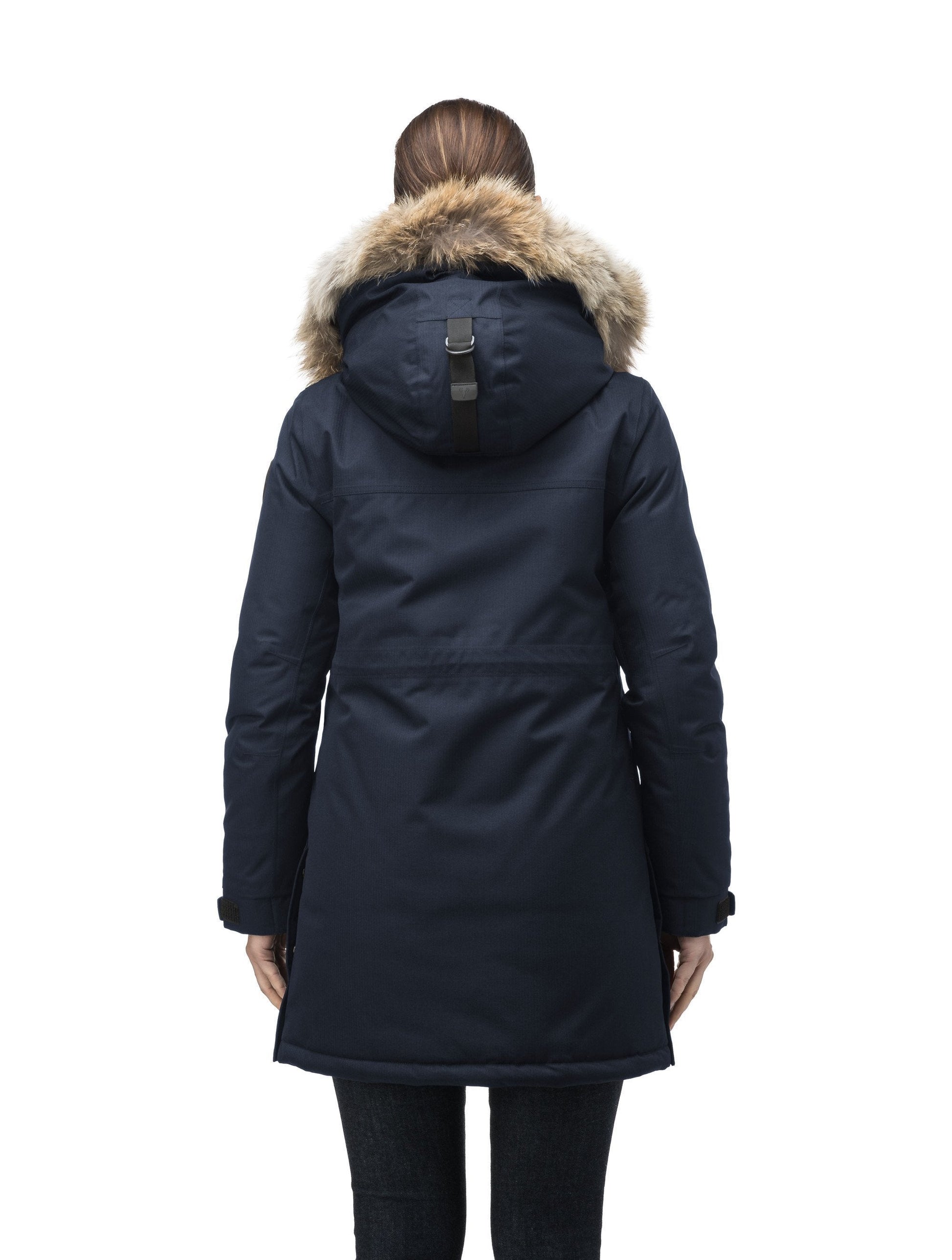 Thigh length women's down filled parka with side entry pockets and drawcord waist, removable hood and fur trim in Navy