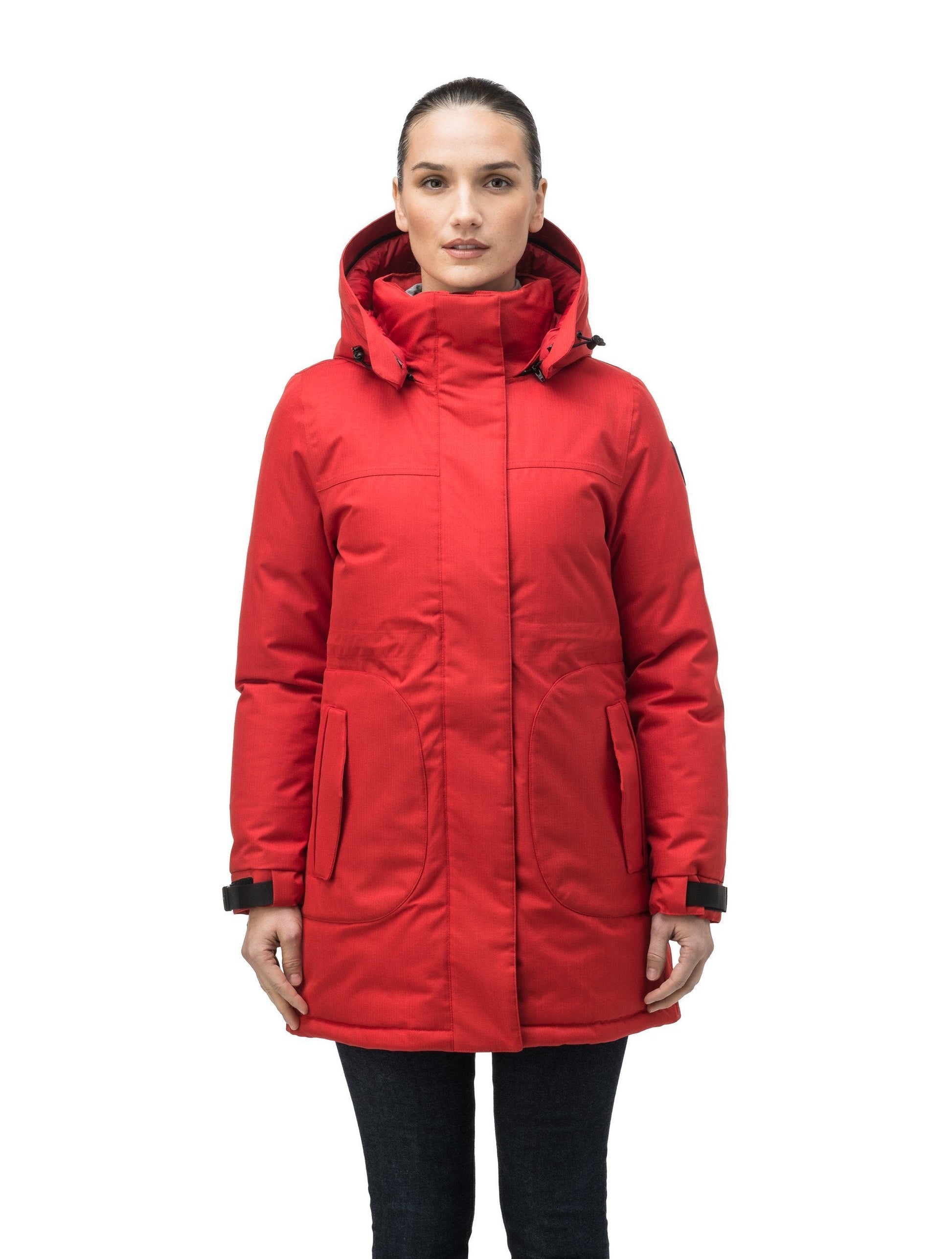 Thigh length women's down filled parka with side entry pockets and drawcord waist, removable hood and fur trim in Vermillion