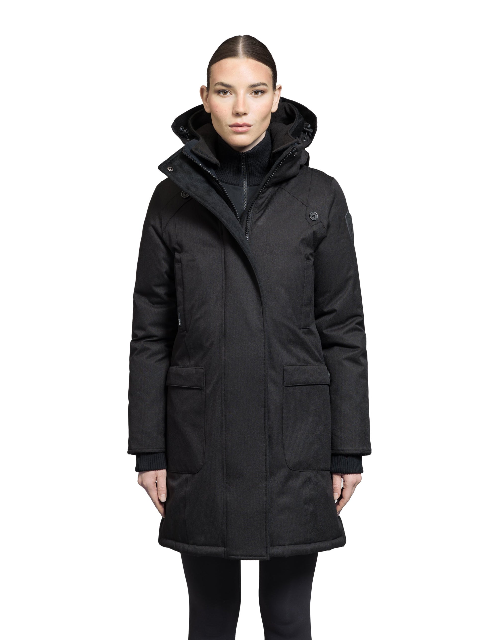 Merideth Furless Ladies Parka in thigh length, Canadian white duck down insulation, removable down-filled hood, centre-front two-way zipper with magnetic wind flap closure, four exterior pockets, and elastic ribbed cuffs, in Black