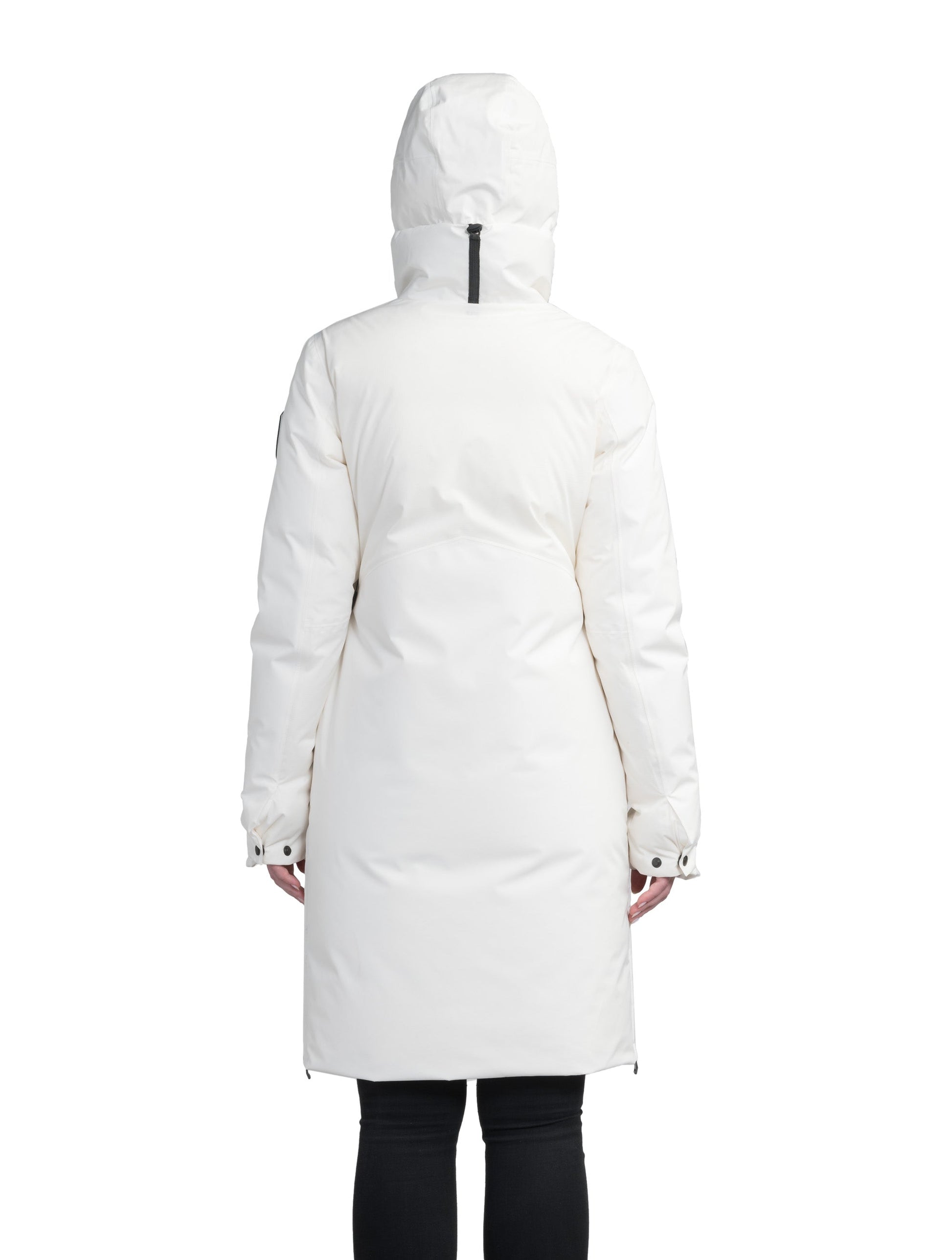 Inara Women's Performance Parka in knee length, premium 3-ply micro denier and stretch ripstop fabrication with DWR coating, Premium Canadian White Duck Down insulation, non-removable down-filled hood, centre front two-way zipper, large vertical zipper pockets along waist, zipper vents along bottom side hem, in Chalk