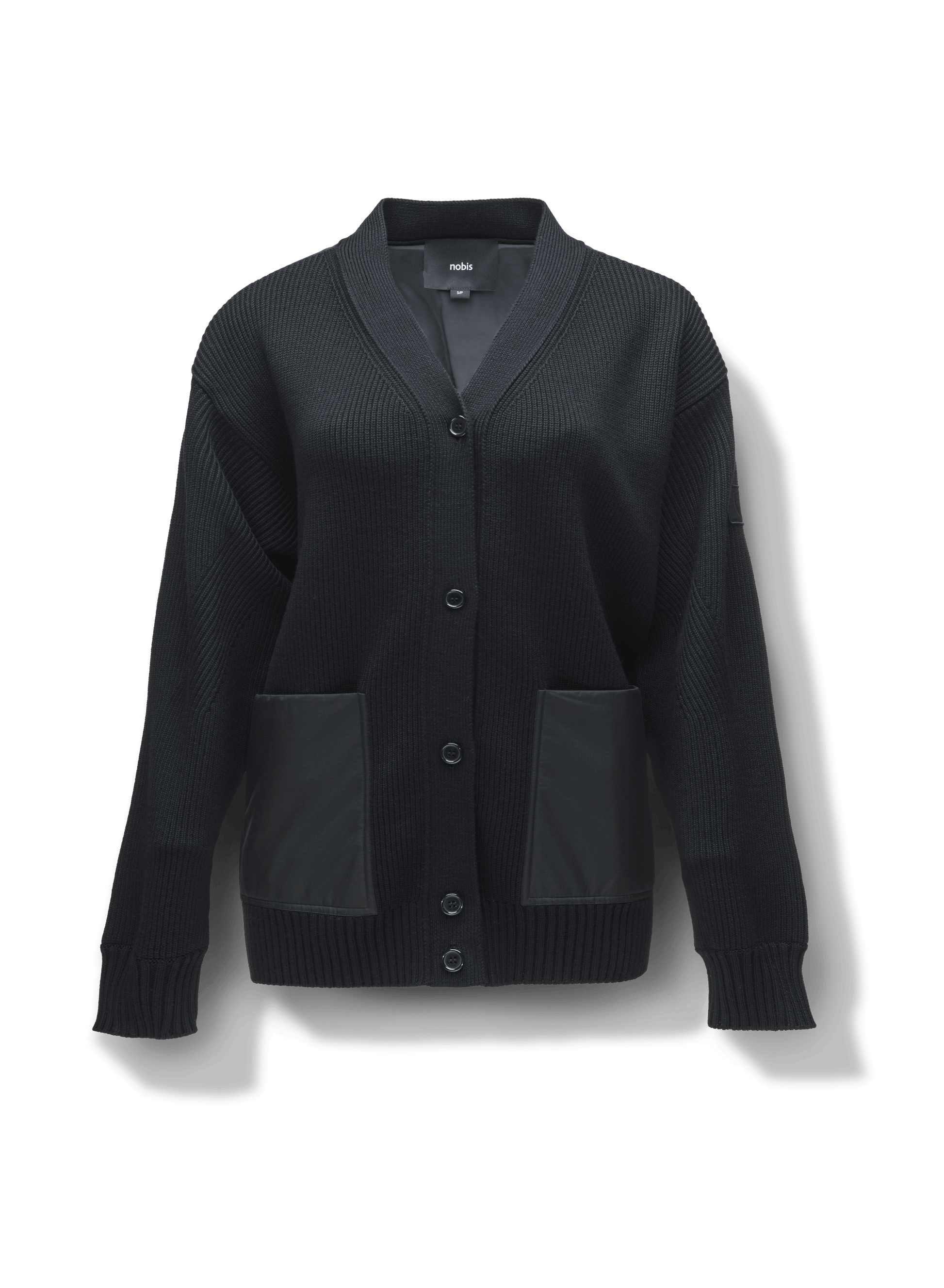 Riga Tailored Button Front Cardigan in thigh length, premium virgin extra fine merino wool knit and stretch ripstop fabrication, Primaloft Gold Insulation Active+, button-front closure, quilted back detailing, front waist pockets, in Black 