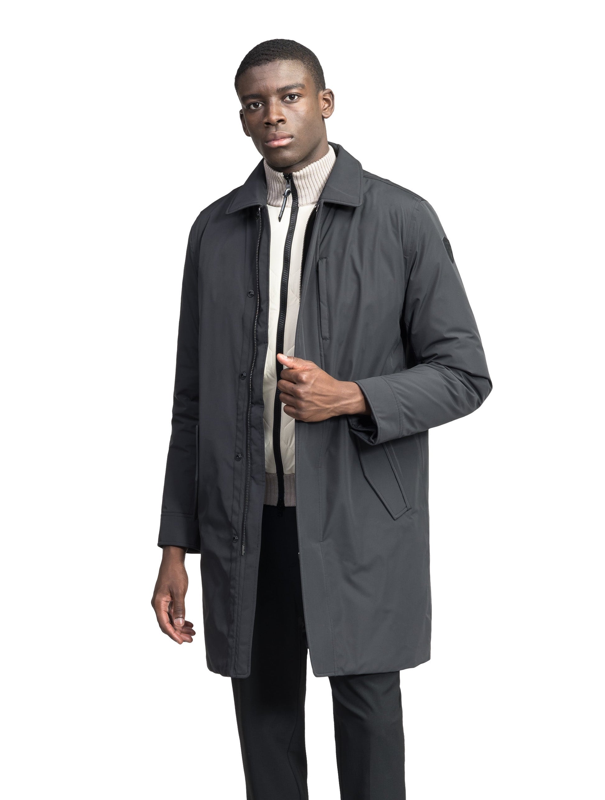 Nord Men's Tailored Trench Coat in knee length, 3-Ply Micro Denier and 4-Way Durable Stretch Weave fabrication, Premium Canadian White Duck Down insulation, removable down-filled hood, exterior zipper pocket at left chest, and adjustable snap button cuffs, in Black