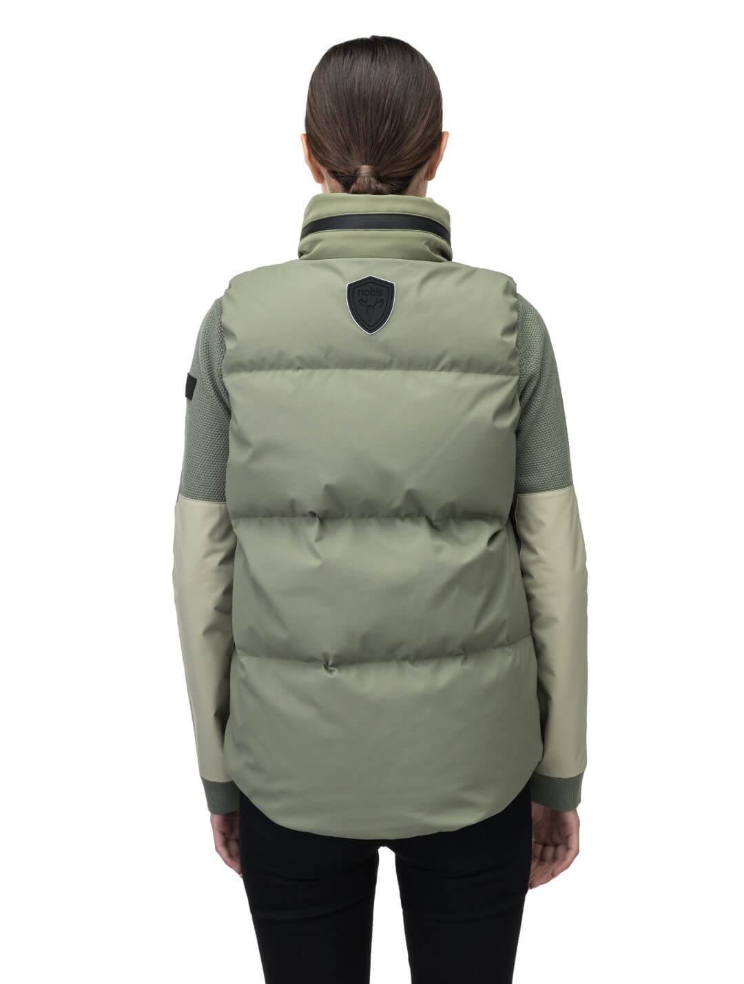 Oren Ladies Performance Vest in hip length, Durable Stretch Ripstop and 3-Ply Micro Denier fabrication, Premium Canadian White Duck Down insulation, tuck-away waterproof hood, and two-way centre front zipper, in Clover