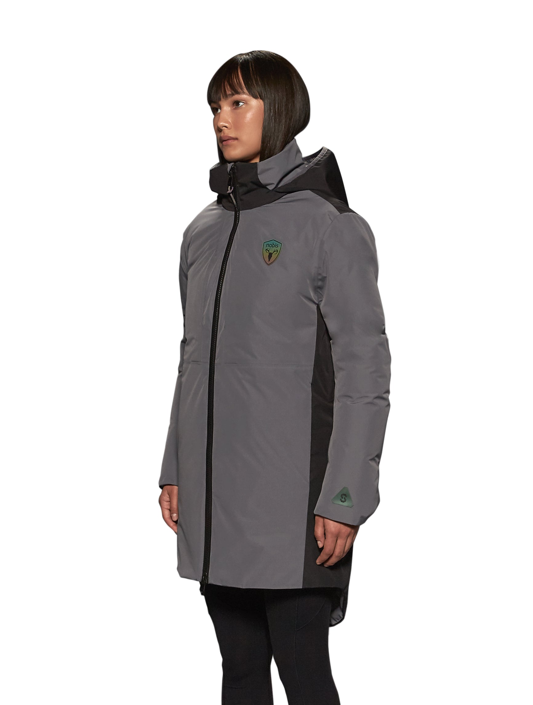 Unisex thigh length down parka with a contrast colour back panel, hidable waterproof hood, and hidden zipper pockets at chest and waist, in Concrete/Black