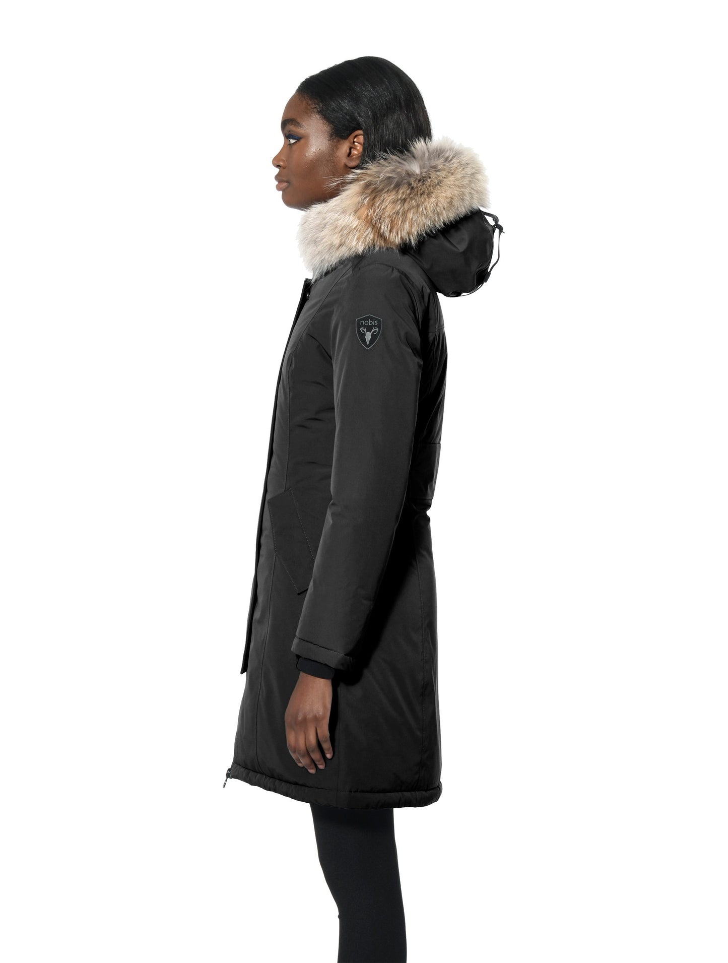 Ladies thigh length down-filled parka with non-removable hood and removable coyote fur trim in Black