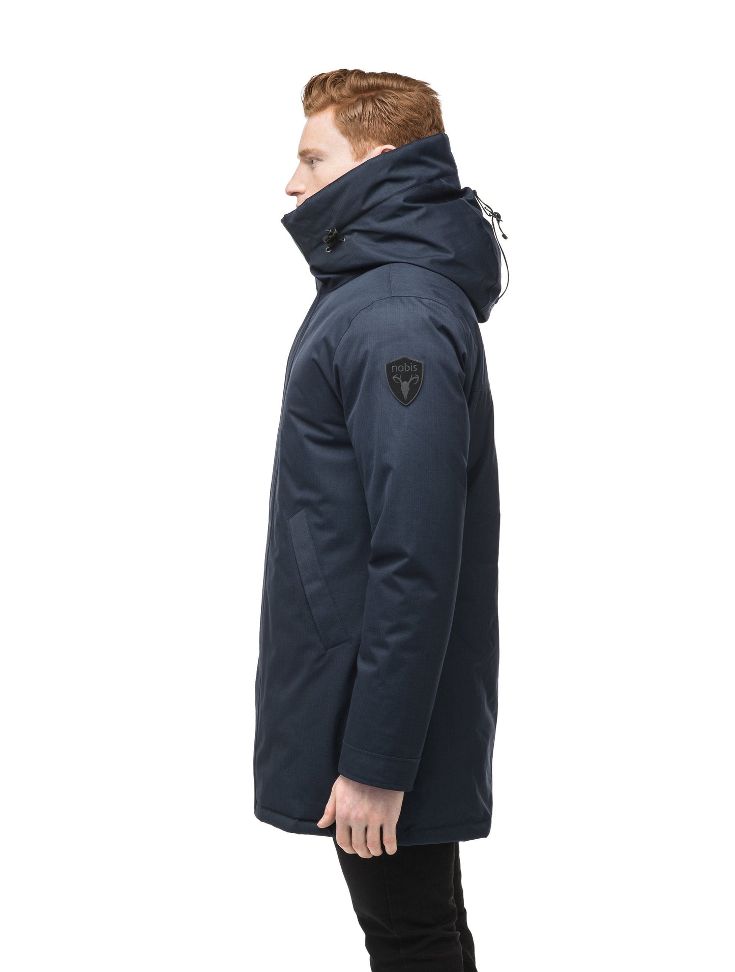 Pierre Men's Jacket in thigh length, Canadian white duck down insulation, non-removable down-filled hood, angled waist pockets, centre-front zipper with wind flap, and elastic ribbed cuffs, in CH Navy