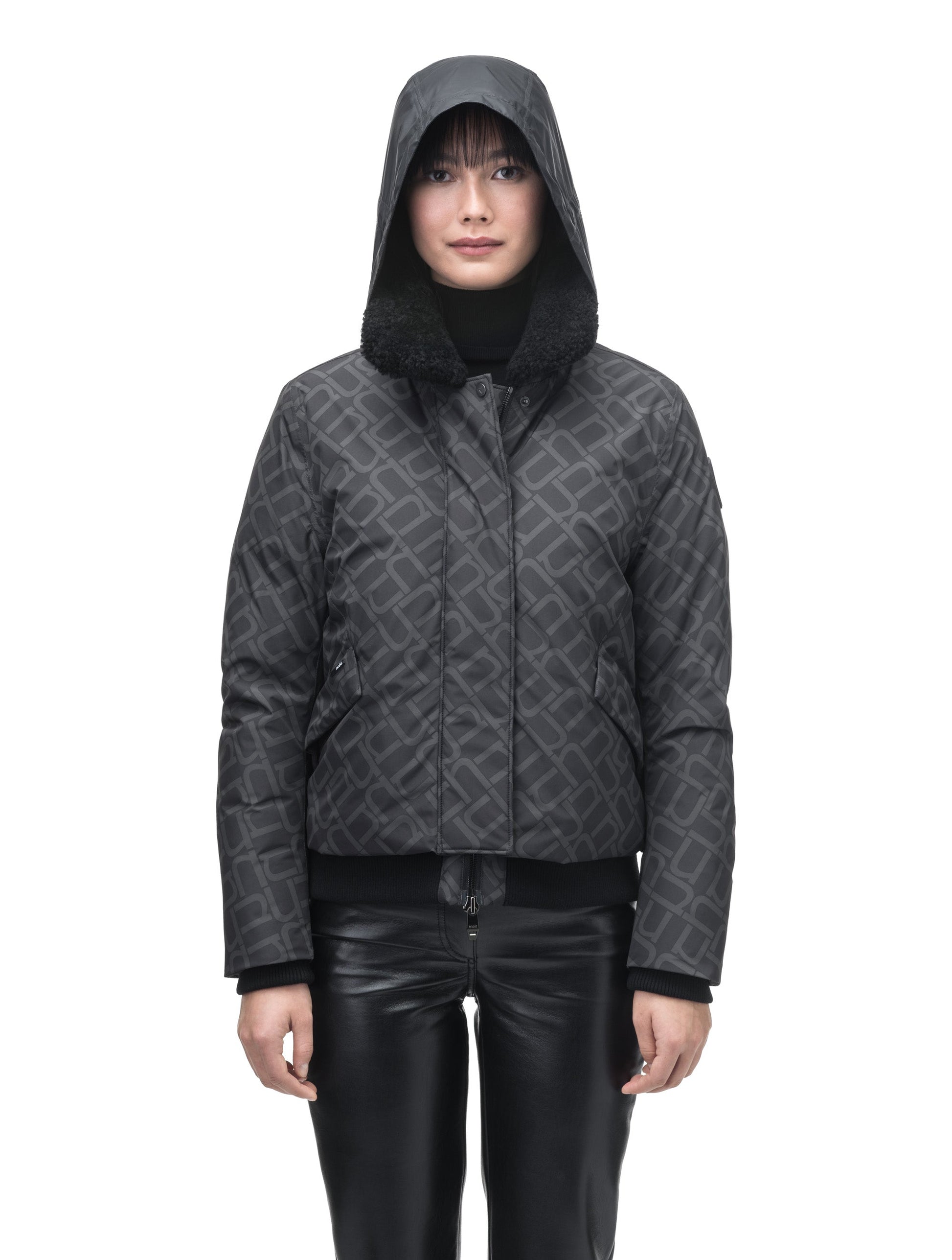 Rae Ladies Aviator Jacket in hip length, Canadian duck down insulation, removable shearling collar with hidden tuckable hood, and two-way front zipper, in Dark Monogram