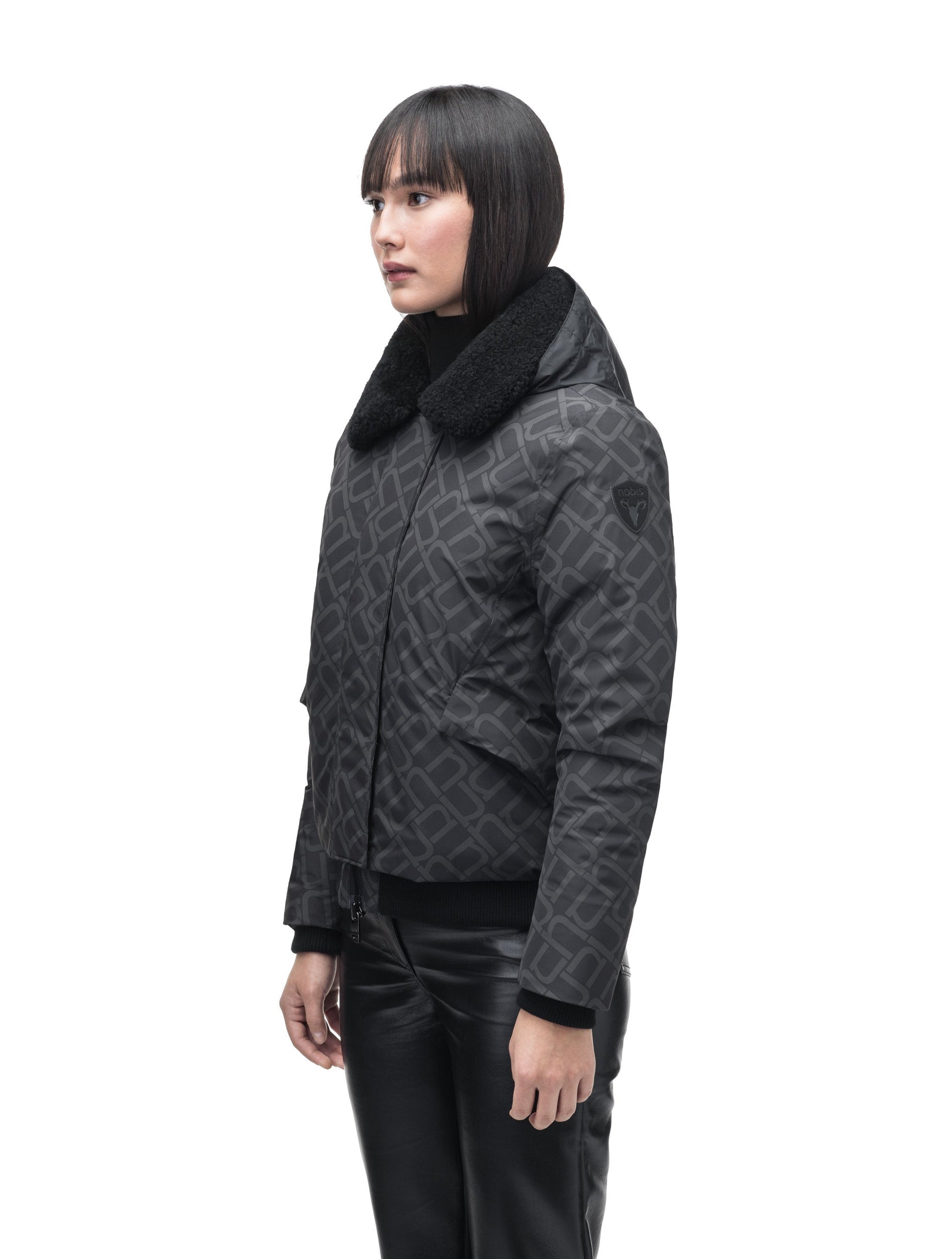 Rae Ladies Aviator Jacket in hip length, Canadian duck down insulation, removable shearling collar with hidden tuckable hood, and two-way front zipper, in Dark Monogram