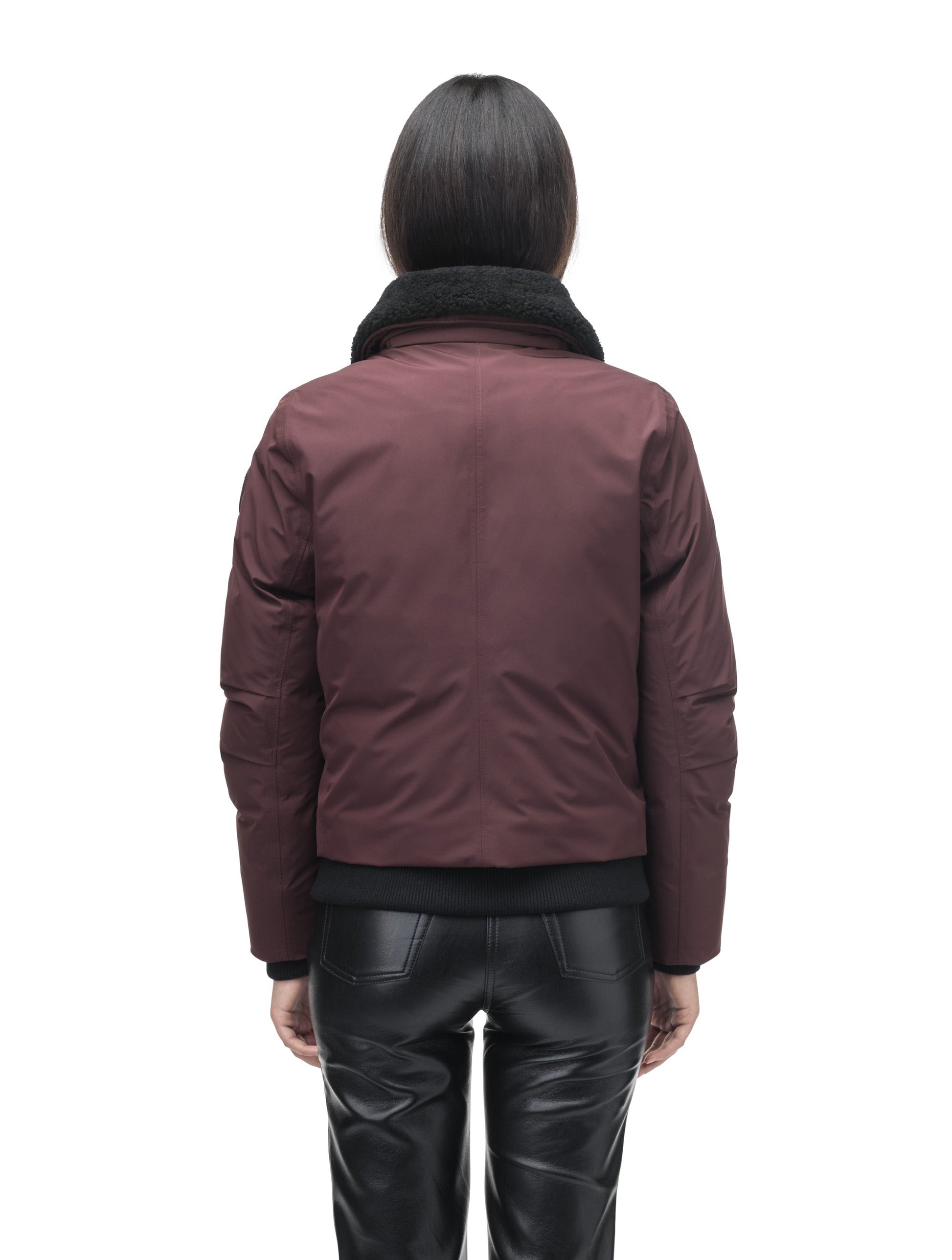 Rae Ladies Aviator Jacket in hip length, Canadian duck down insulation, removable shearling collar with hidden tuckable hood, and two-way front zipper, in Merlot