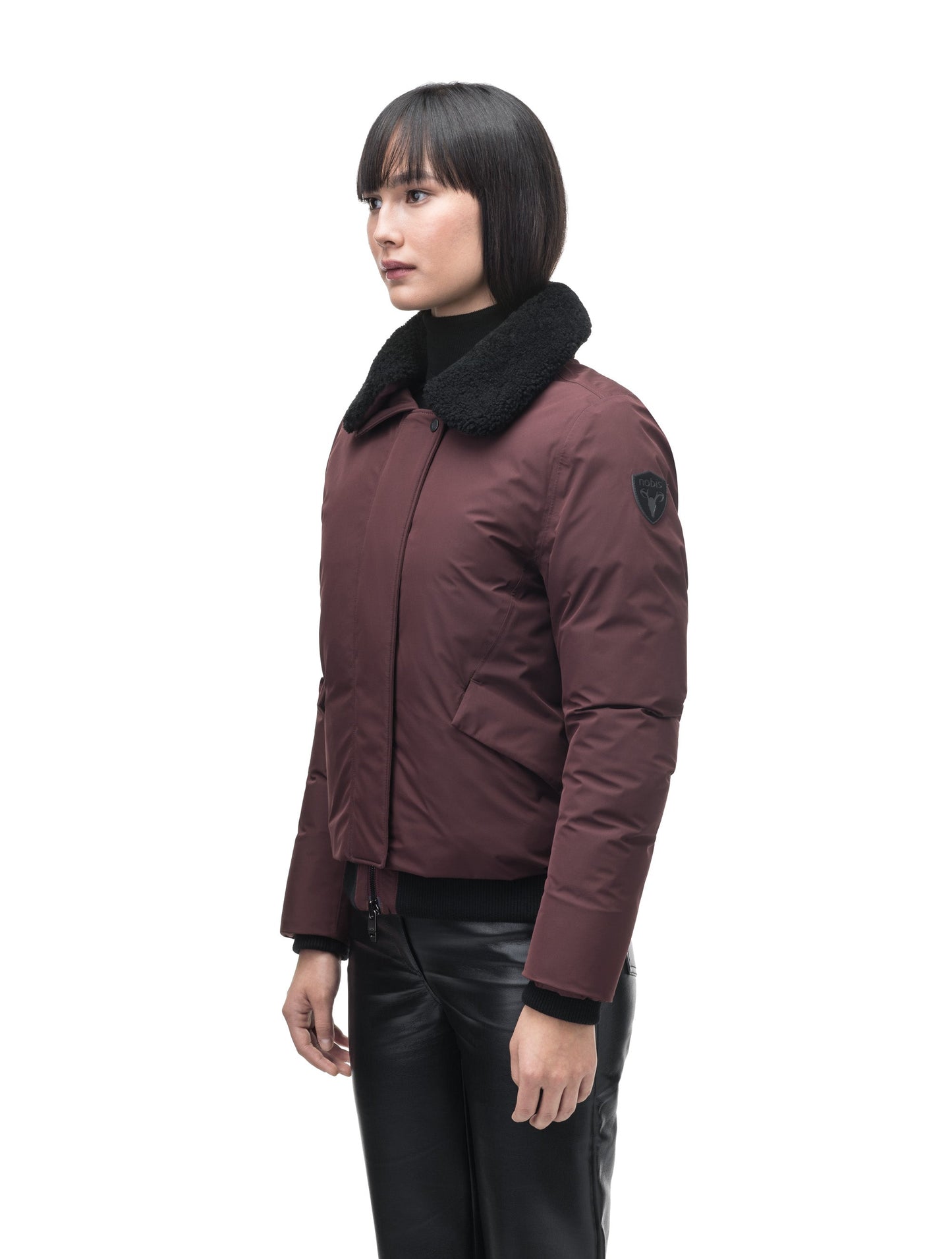 Rae Ladies Aviator Jacket in hip length, Canadian duck down insulation, removable shearling collar with hidden tuckable hood, and two-way front zipper, in Merlot