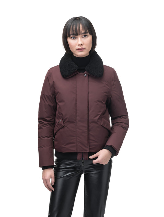 Rae Ladies Aviator Jacket in hip length, Canadian duck down insulation, removable shearling collar with hidden tuckable hood, and two-way front zipper, in Merlot + Merlot