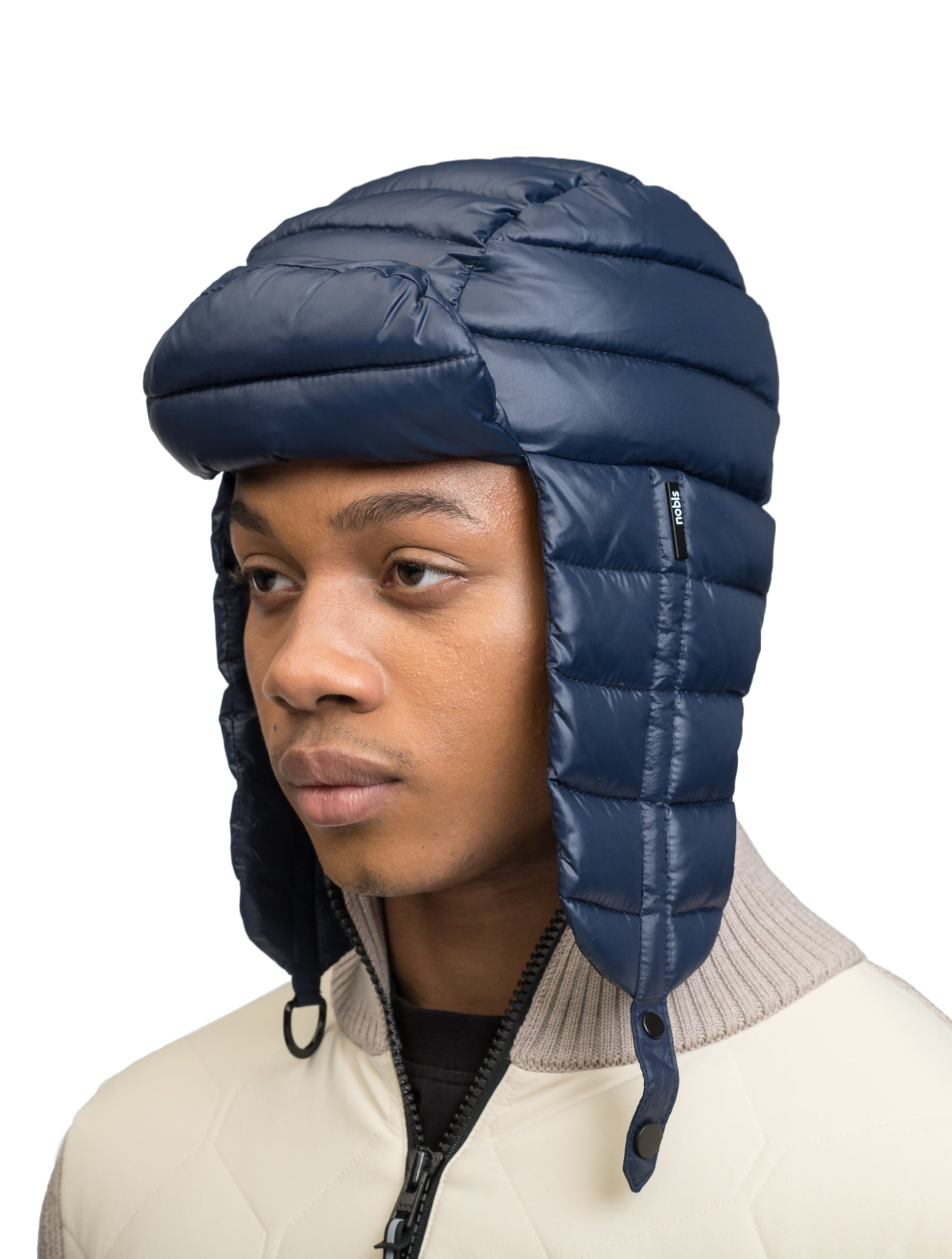 Unisex down-filled quilted fargo hat with adjustable chin strap in Marine