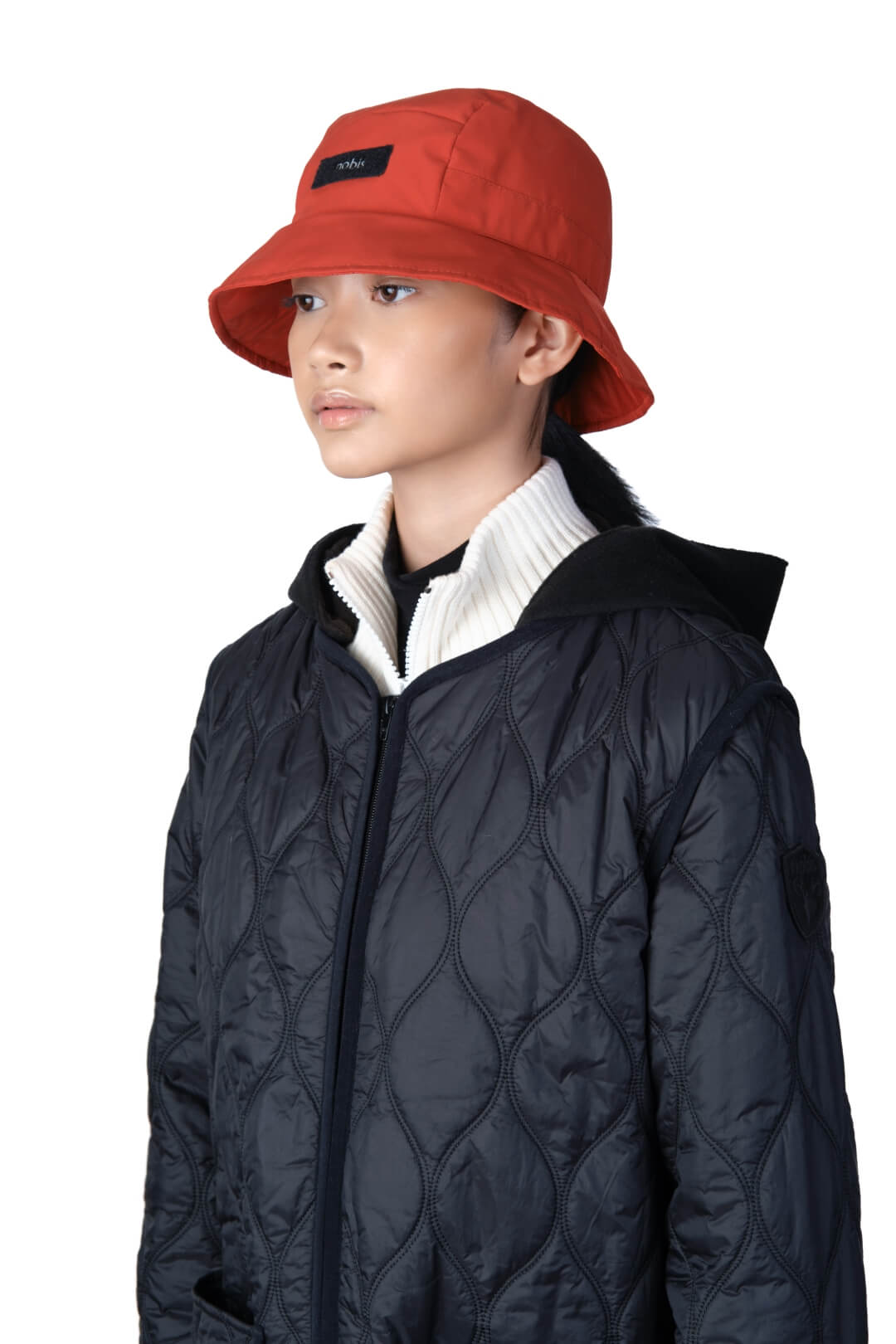 Lunar New Year Reversible Bucket Hat with one side in red tiger print, and the reverse side in tonal red with Nobis label branding on the crown front, in Vermillion