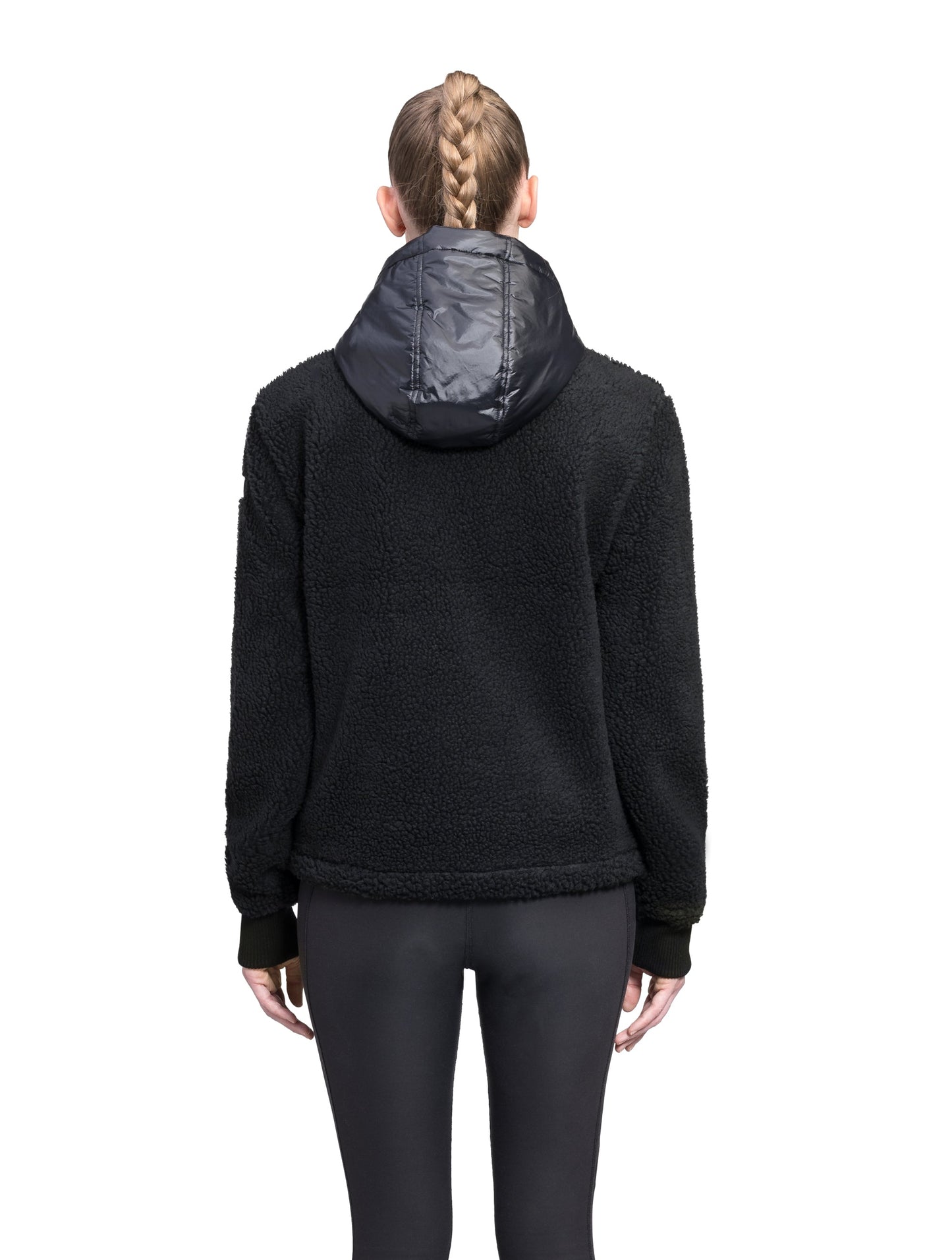 Roche Women's Hybrid Berber Pullover Hoodie in hip length, premium berber and cire technical nylon taffeta fabrication, Primaloft Gold Insulation Active+, non-removable hood with zipper at collar, kangaroo pocket with magnetic closure flap and additional side-entry pockets, ribbed cuffs, adjustable drawcords at side hem, in Black