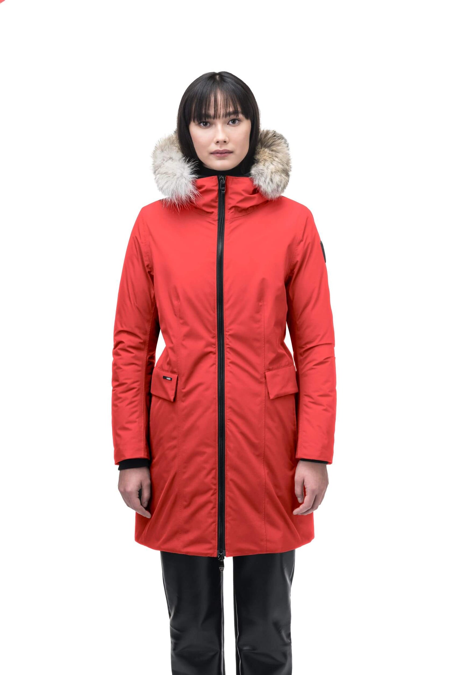 Romeda Ladies Mid Thigh Parka in thigh length, Canadian duck down insulation, non-removable hood with removable fur ruff trim, and two-way front zipper, in Vermillion