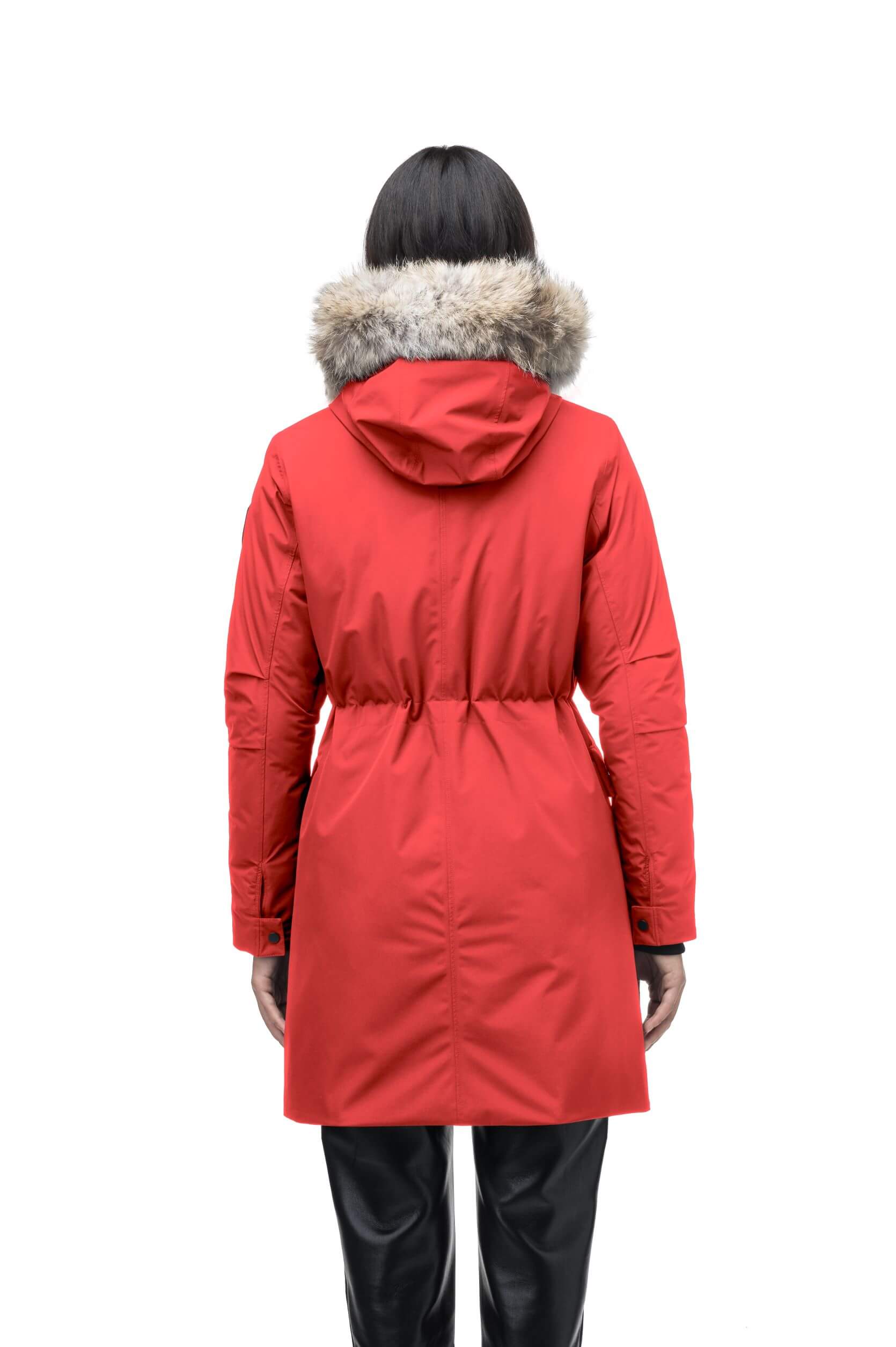 Romeda Ladies Mid Thigh Parka in thigh length, Canadian duck down insulation, non-removable hood with removable fur ruff trim, and two-way front zipper, in Vermillion