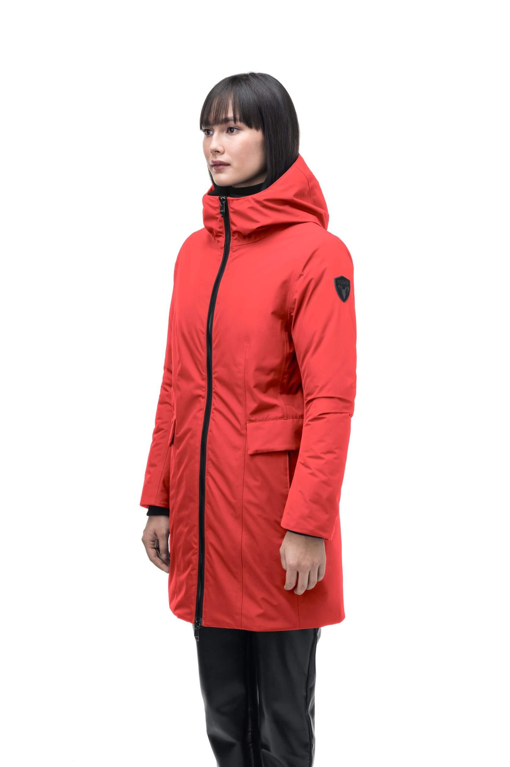 Romeda Ladies Mid Thigh Parka in thigh length, Canadian duck down insulation, non-removable hood with removable fur ruff trim, and two-way front zipper, in Vermillion