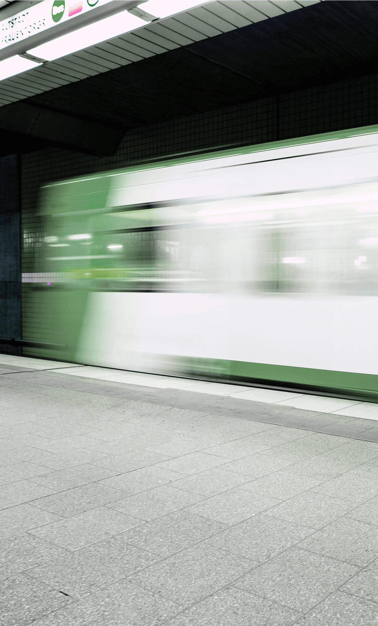 Comfrey coloured metro subway train with blur effect.
