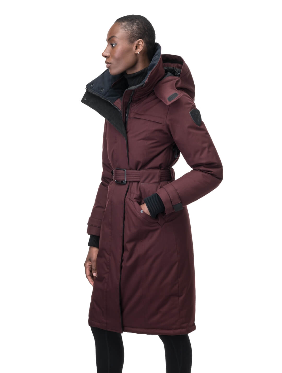 Women's knee length down filled parka with a belted waist and fully removable Coyote and Rex Rabbit fur ruffs in Merlot