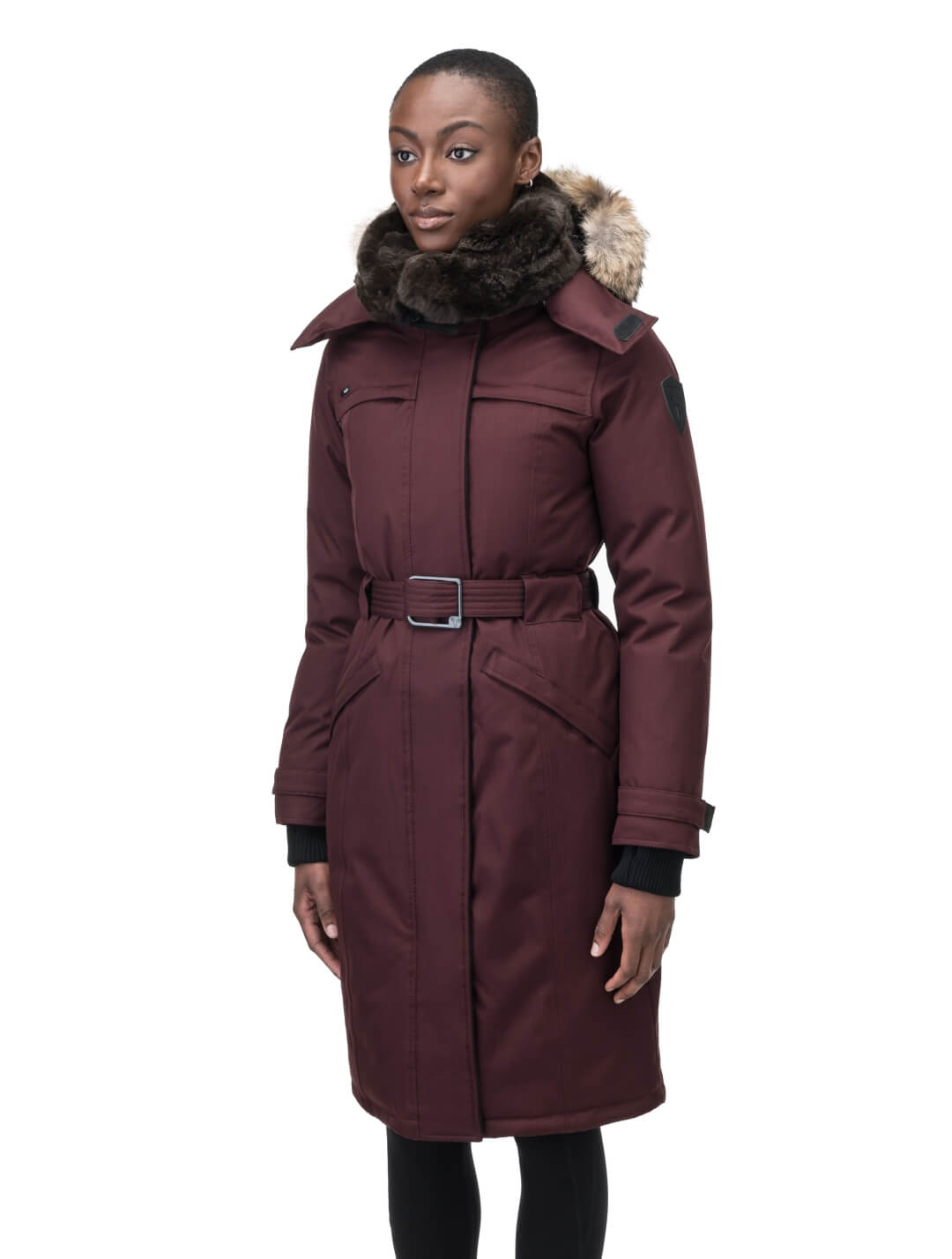 Women's knee length down filled parka with a belted waist and fully removable Coyote and Rex Rabbit fur ruffs in Merlot