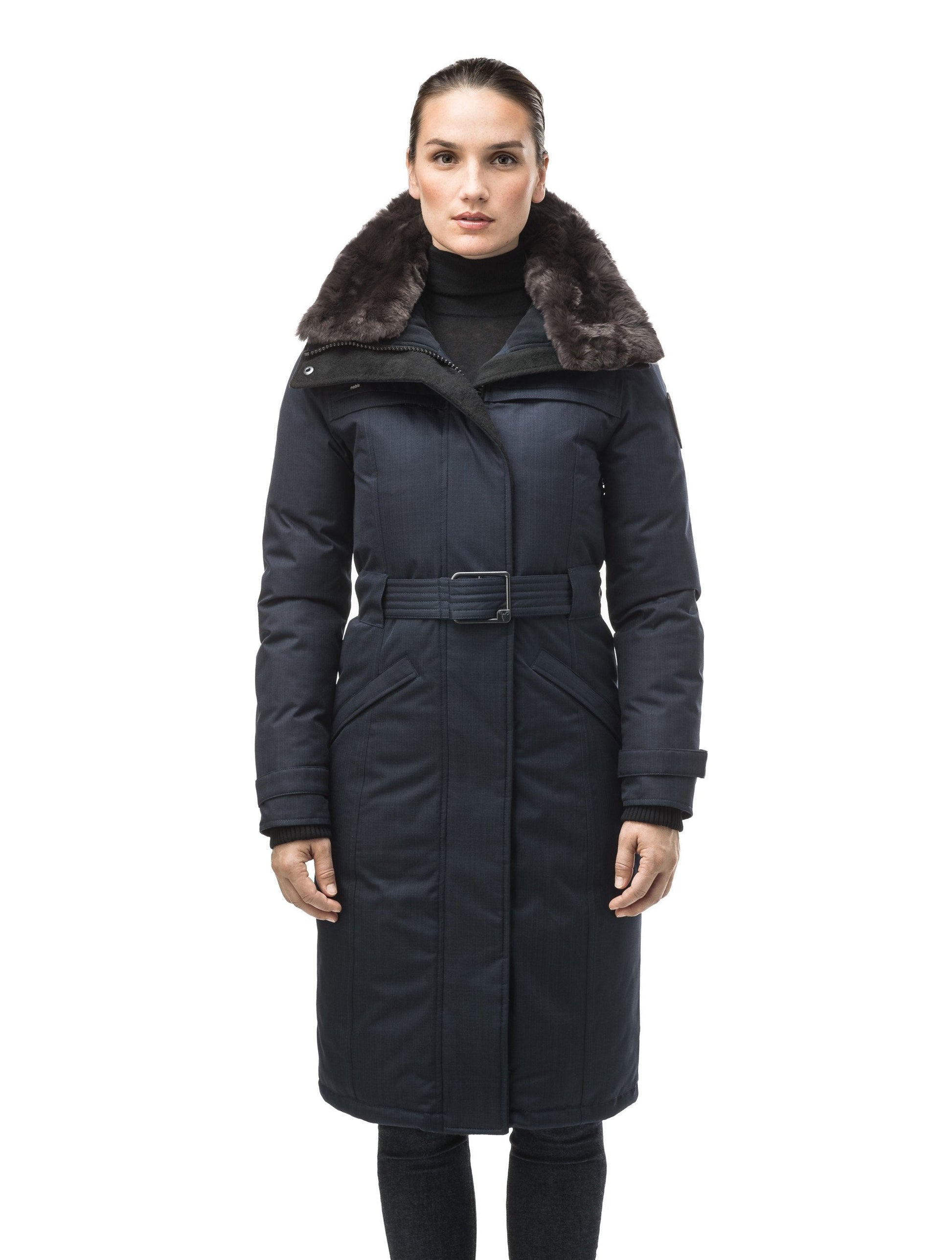 Women's knee length down filled parka with a belted waist and fully removable Coyote and Rex Rabbit fur ruffs in CH Navy