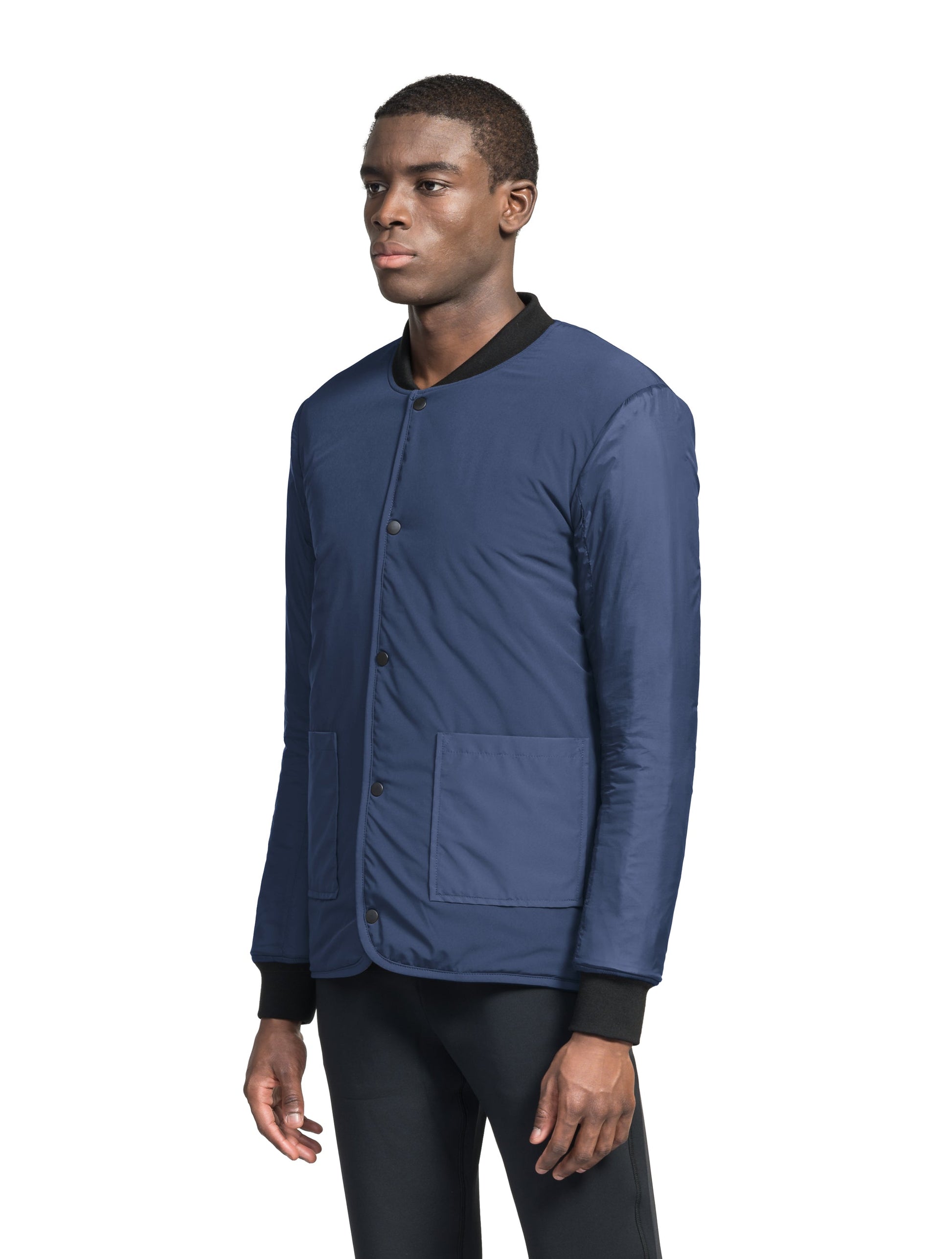 Speck Men's Tailored Mid Layer Jacket in hip length, Primaloft Gold Insulation Active+, diamond quilted body, rib knit collar and cuffs, snap buton front closure, and hidden side-entry zipper pockets at waist, in Blueprint