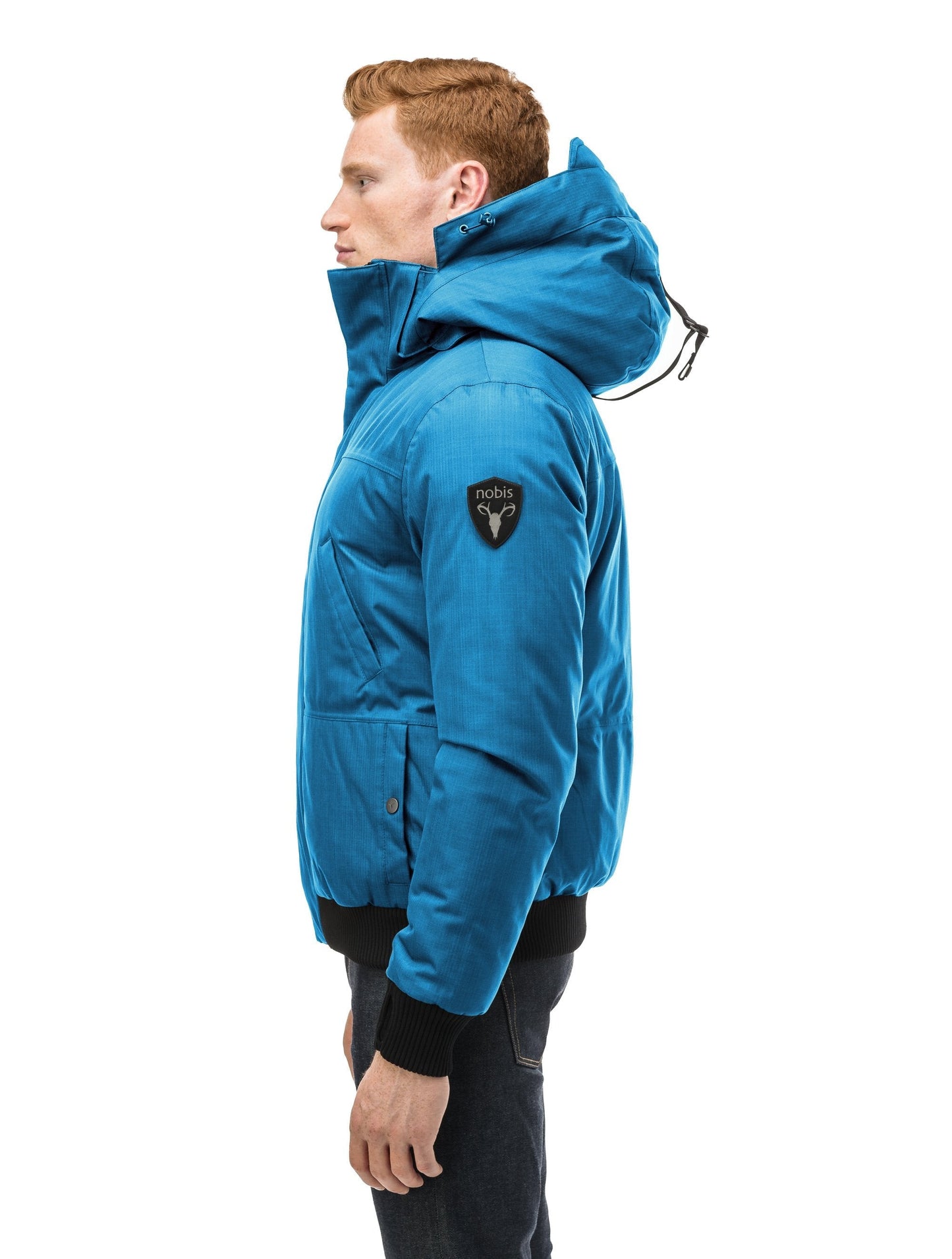 Men's sleek down filled bomber jacket with clean details and a fur free hood in Sea Blue