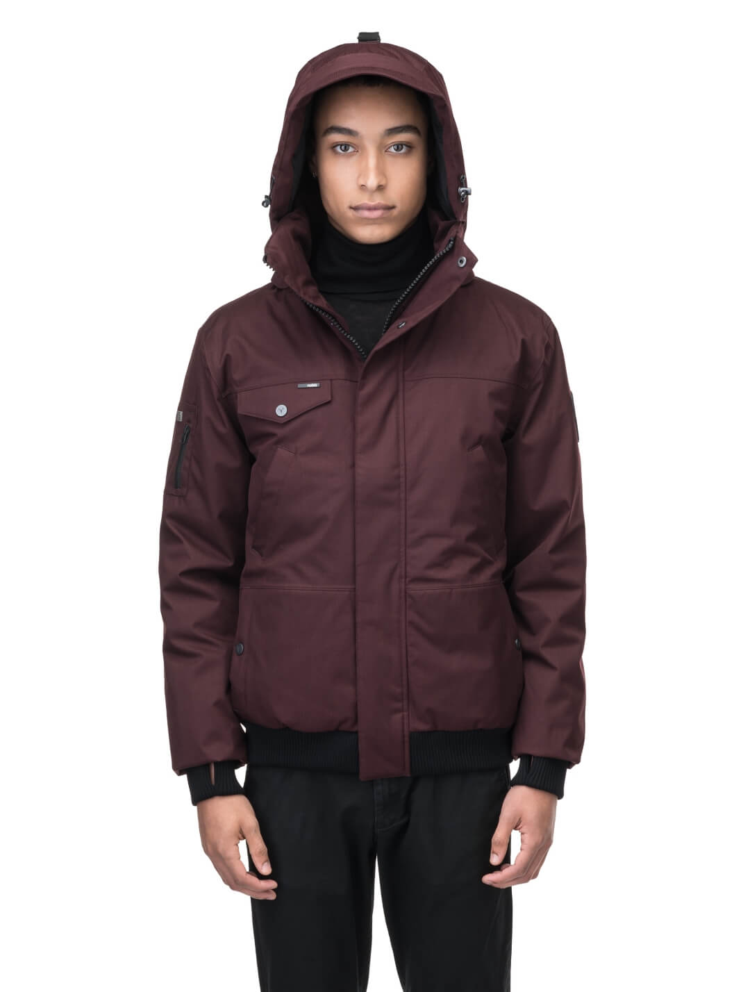 Men's sleek down filled bomber jacket with clean details and a fur free hood in Merlot