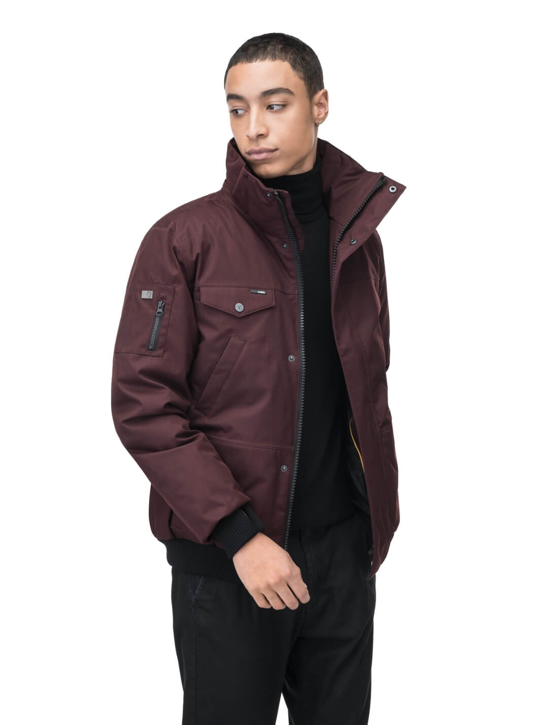 Men's sleek down filled bomber jacket with clean details and a fur free hood in Merlot