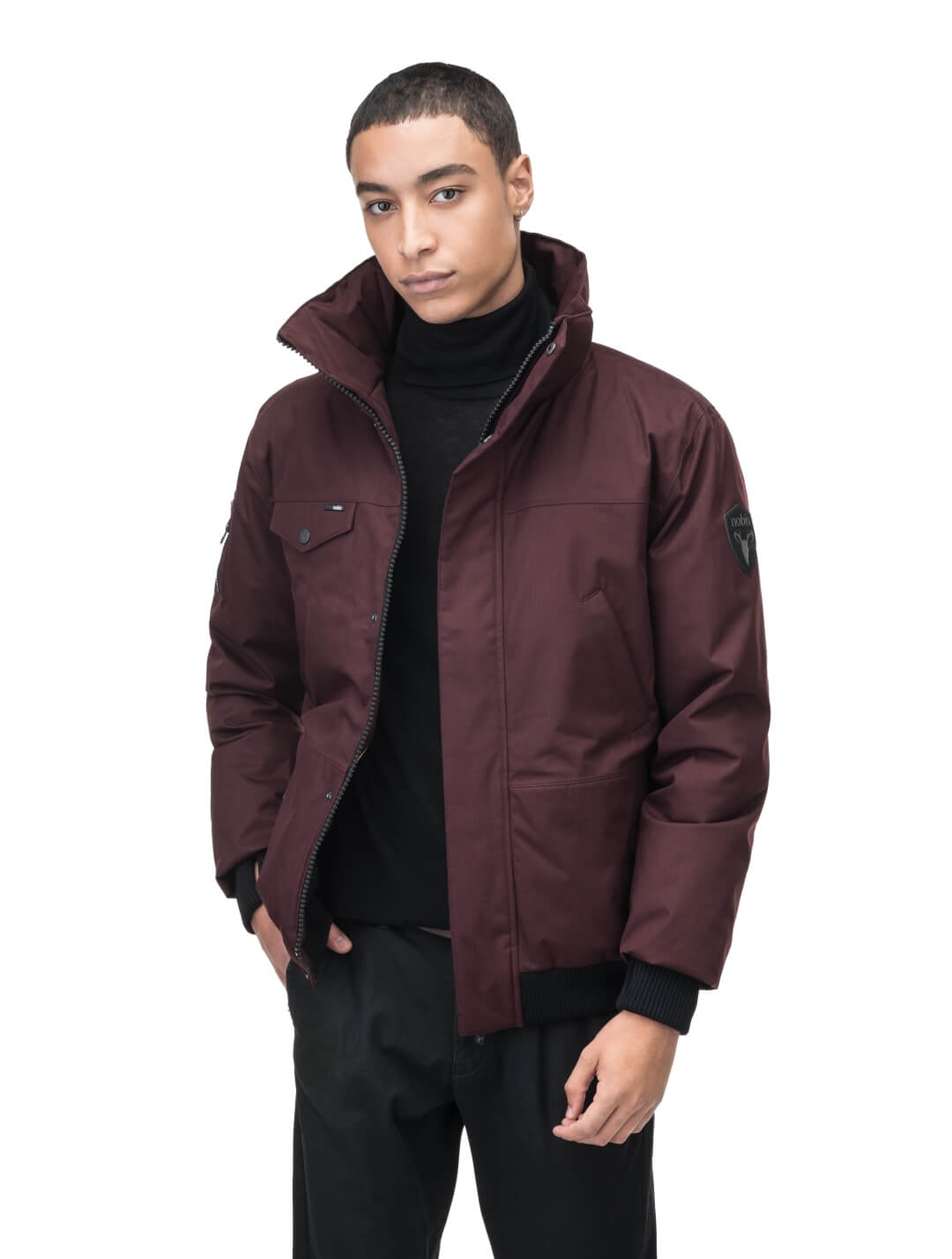 Men's sleek down filled bomber jacket with clean details and a fur free hood in Merlot