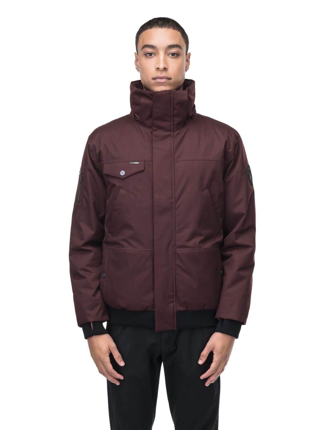 Men's sleek down filled bomber jacket with clean details and a fur free hood in Merlot