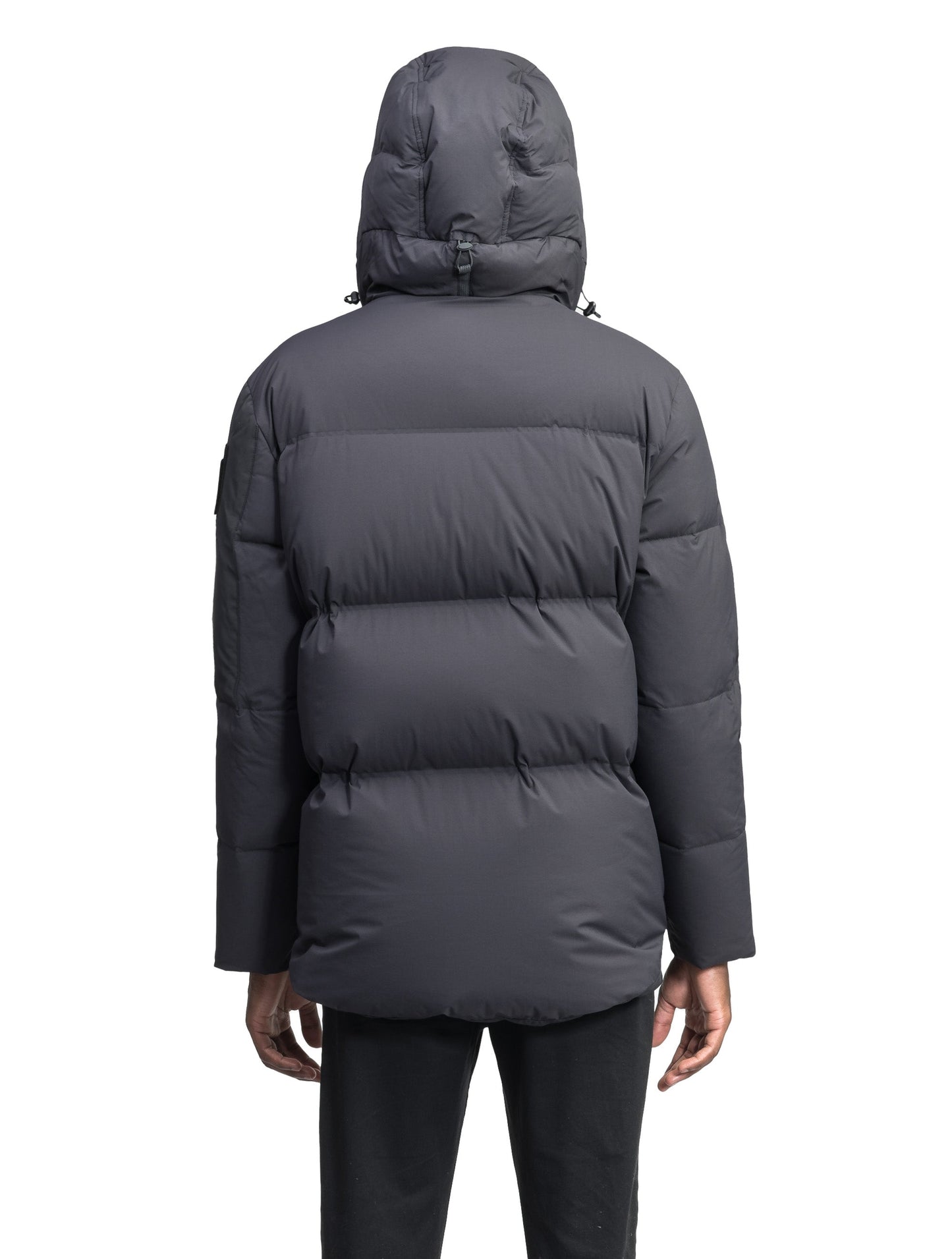 Supra Men's Performance Puffer in hip length, Technical Taffeta and 3-Ply Micro Denier fabrication, Premium Canadian White Duck Down insulation, non-removable down filled hood, centre front two-way zipper, flap pockets at waist, and zipper pocket at left bicep, in Black