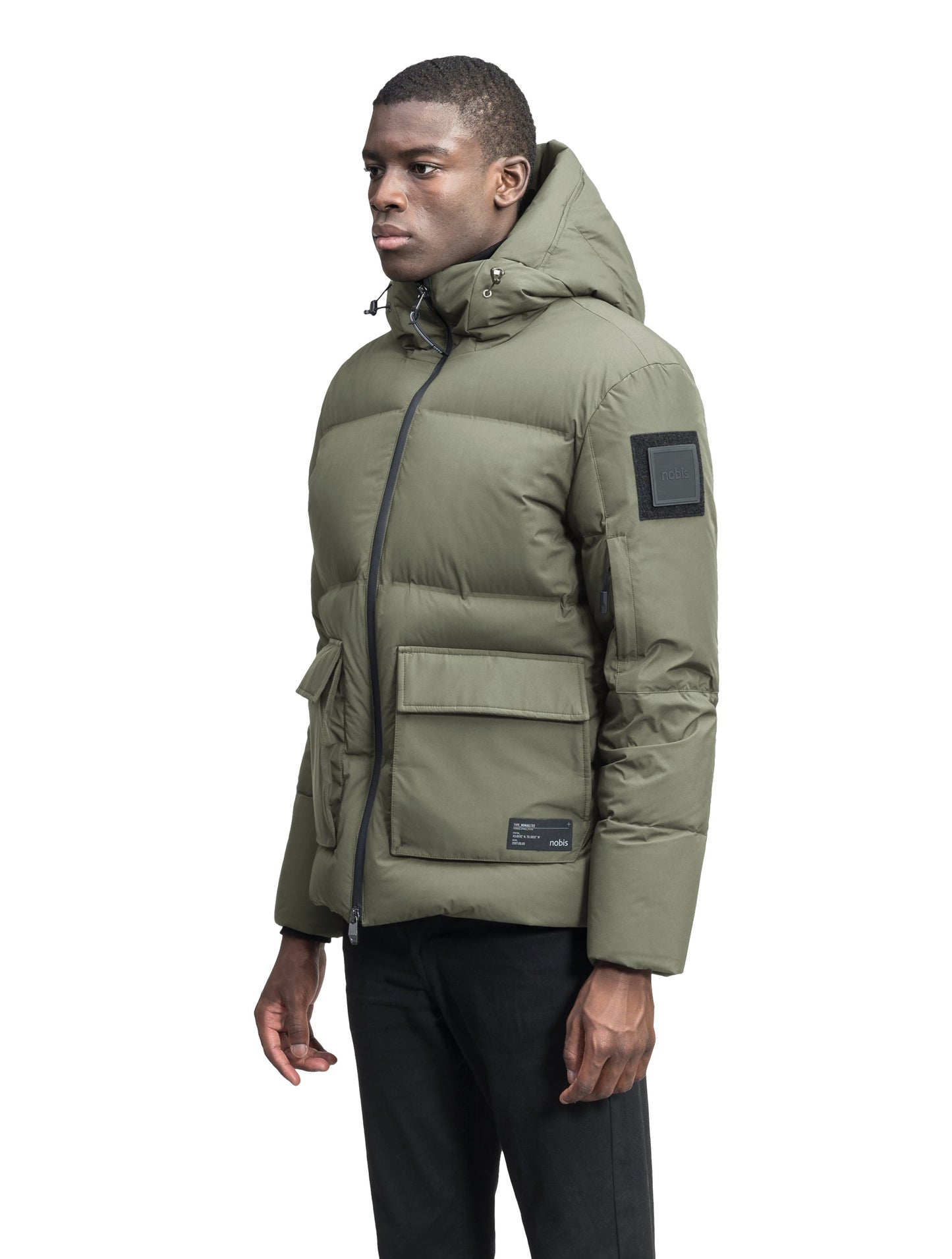 Supra Men's Performance Puffer in hip length, Technical Taffeta and 3-Ply Micro Denier fabrication, Premium Canadian White Duck Down insulation, non-removable down filled hood, centre front two-way zipper, flap pockets at waist, and zipper pocket at left bicep, in Clover